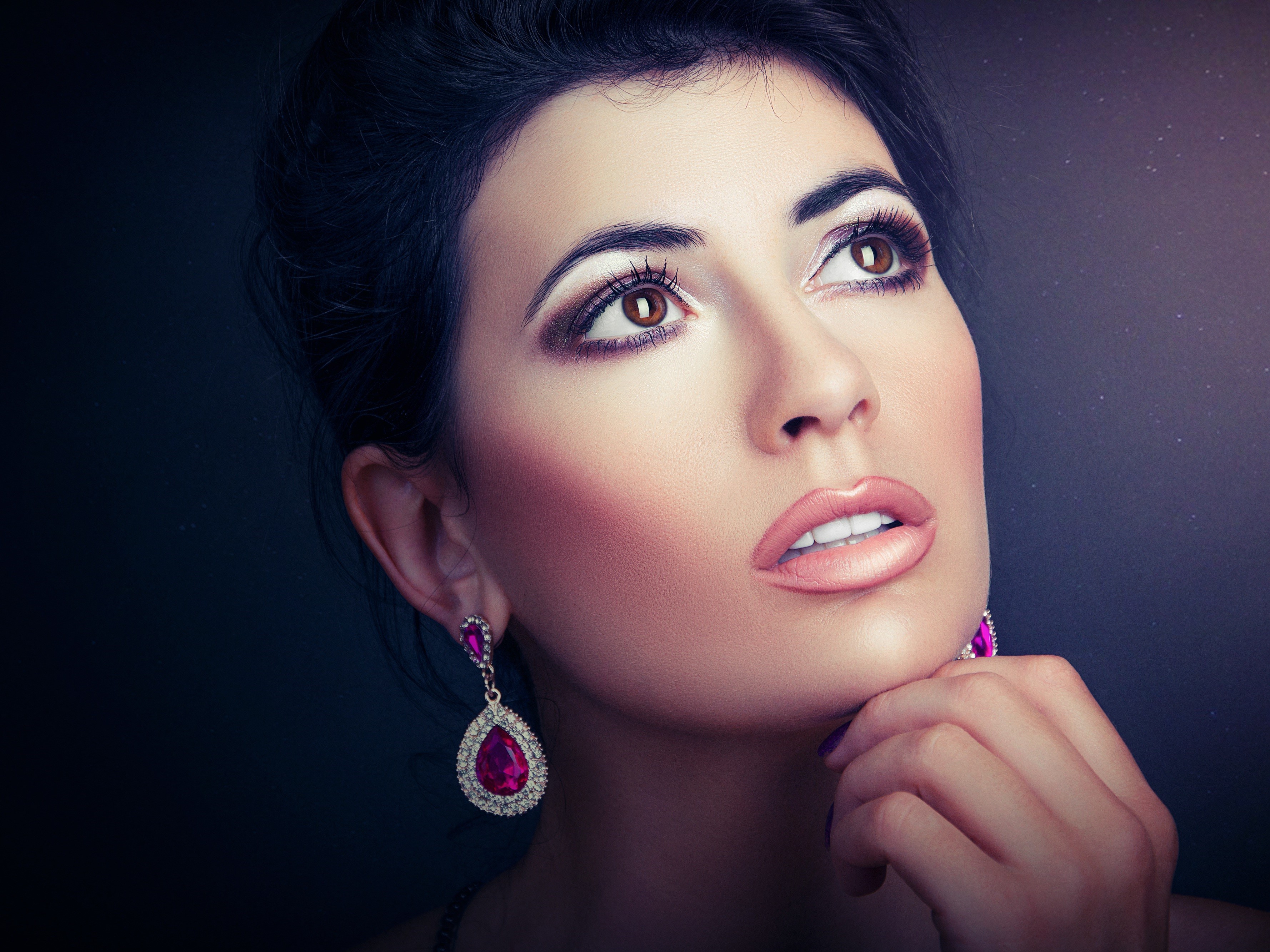 Woman with dramatic makeup and pink earrings HD Wallpaper