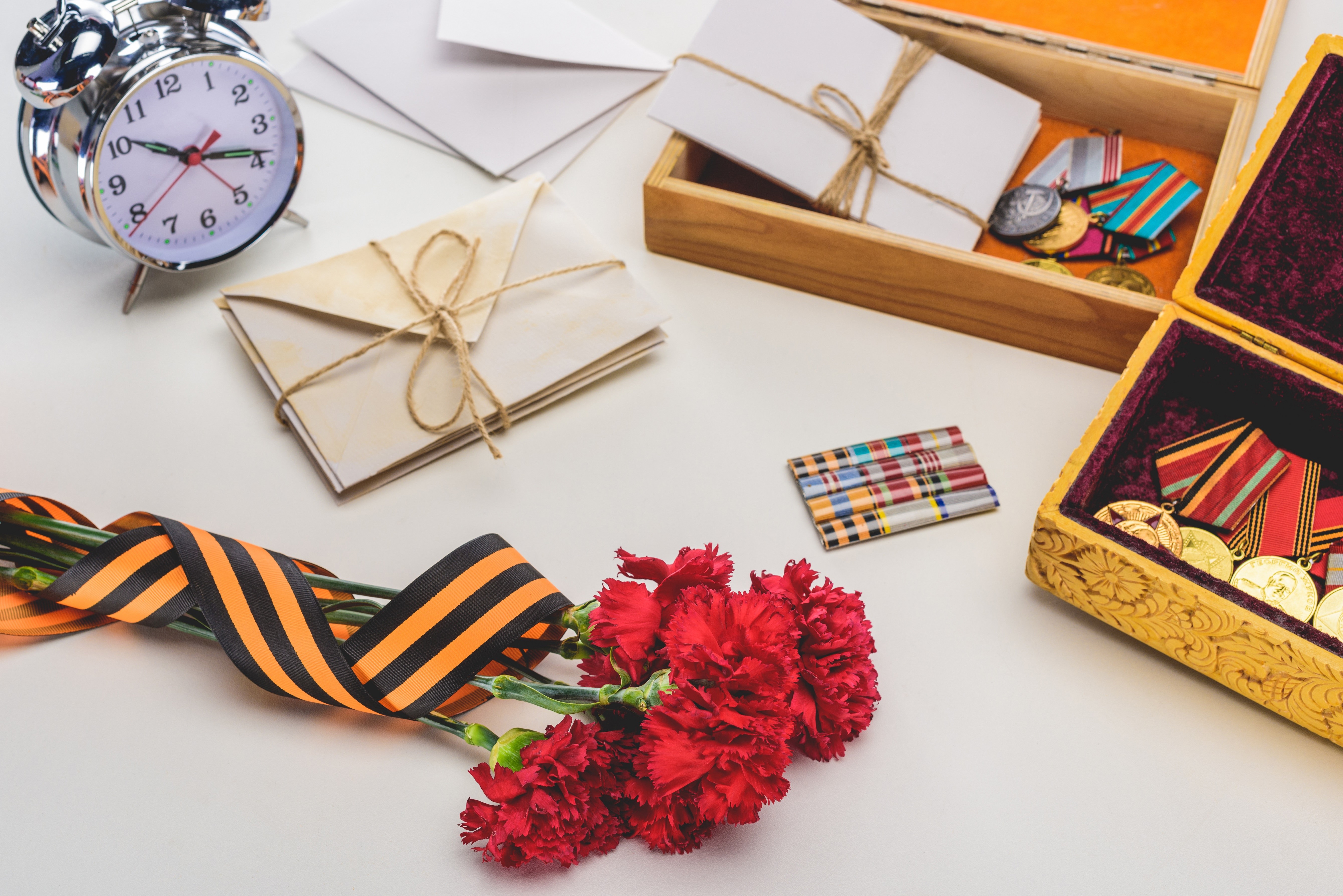 Victory Day composition with carnations and medals HD Wallpaper