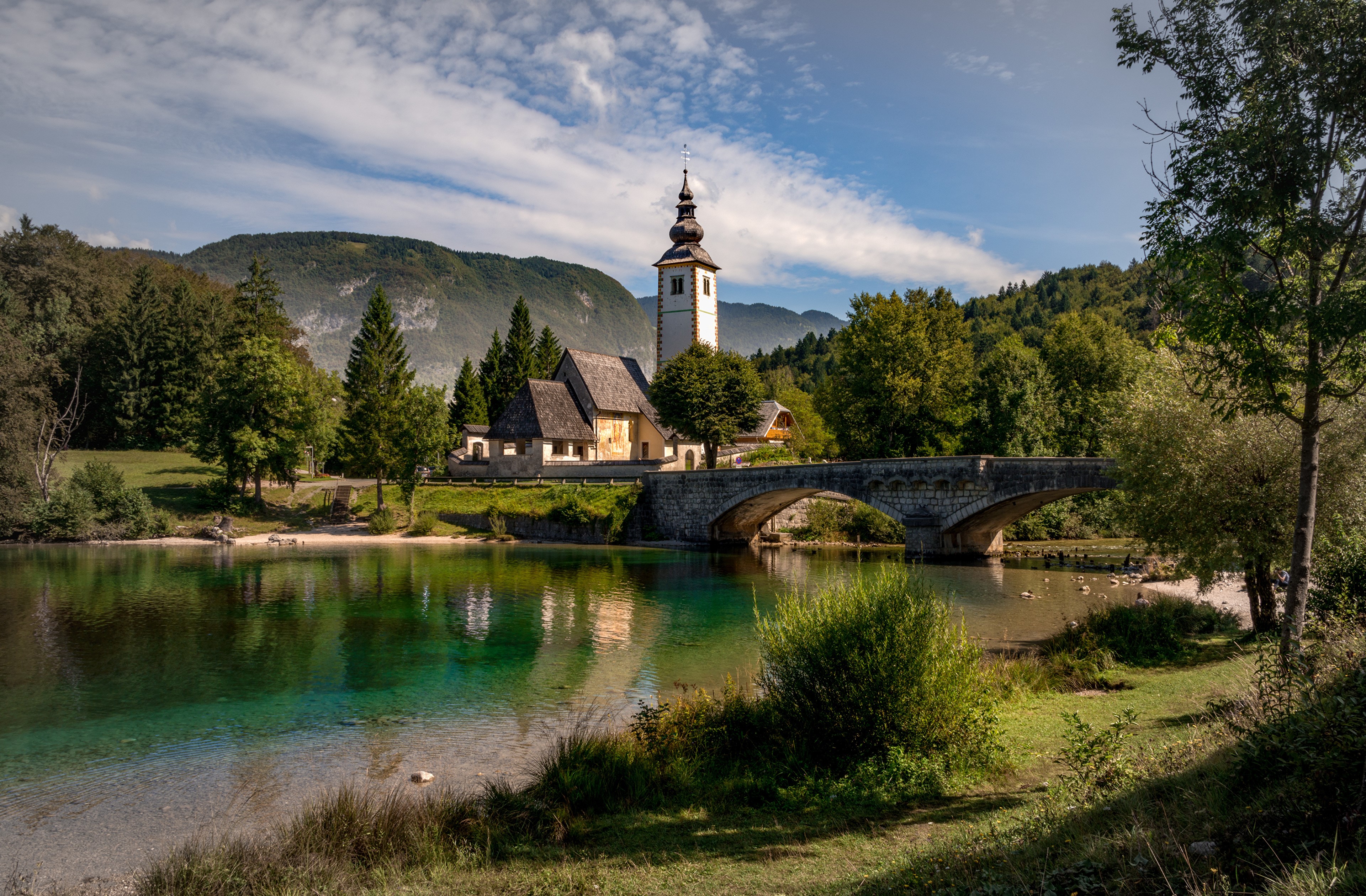 Church and bridge over lake in Triglav National Park, Slovenia HD Wallpaper