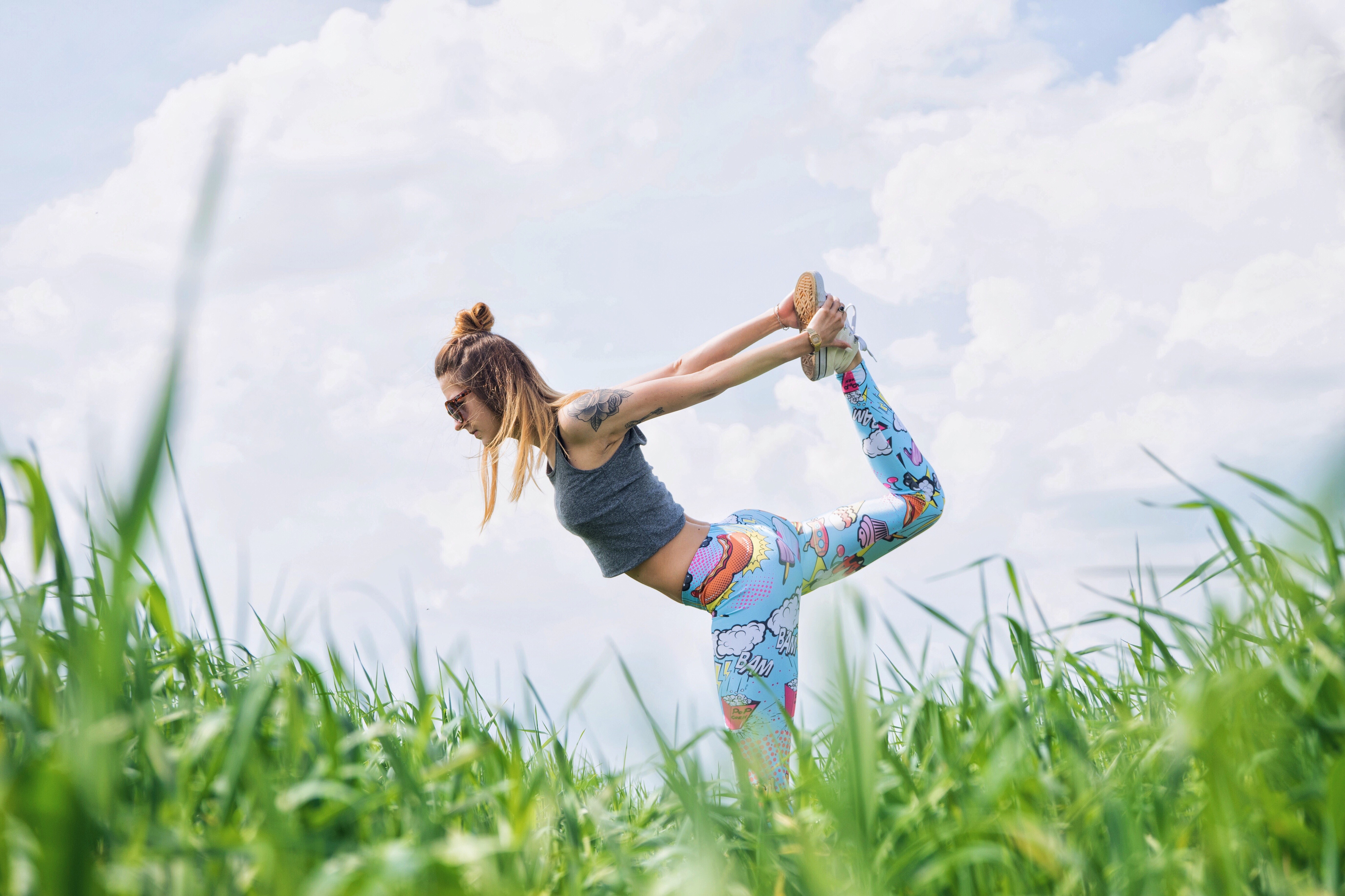 Woman doing yoga in a field HD Wallpaper