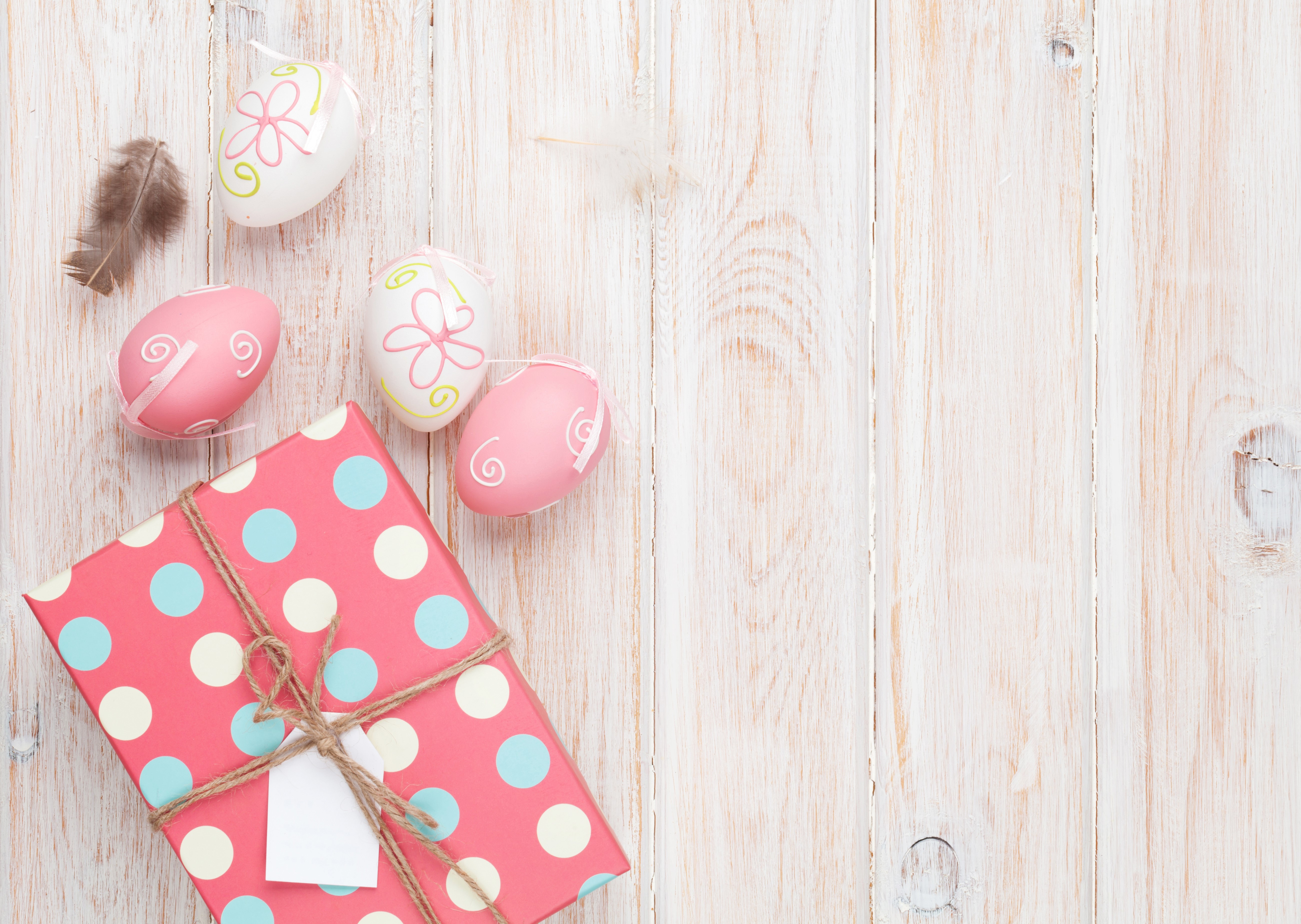 Easter eggs and gift on wooden planks HD Wallpaper