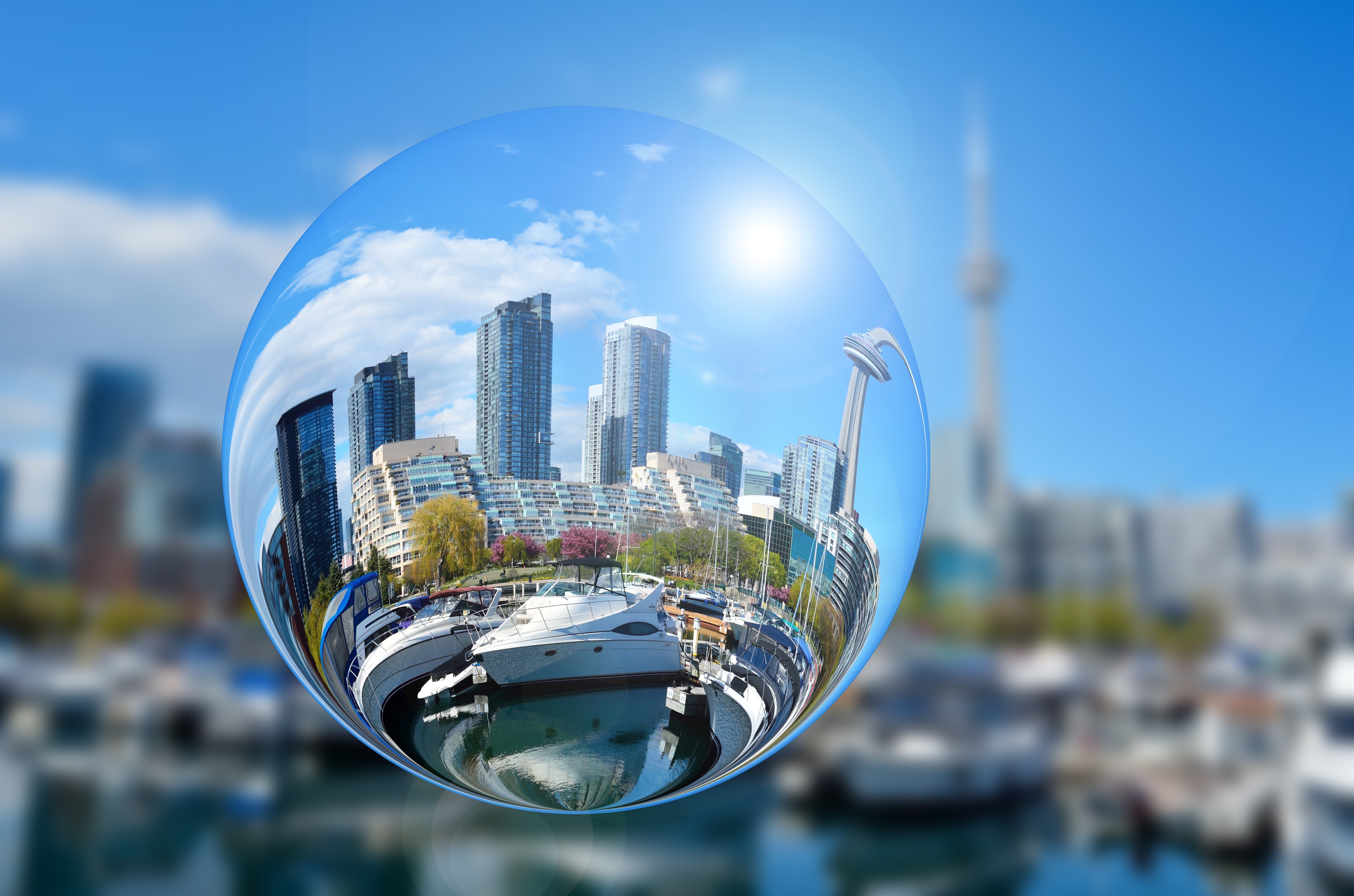 Cityscape reflected in a glass ball with yachts HD Wallpaper