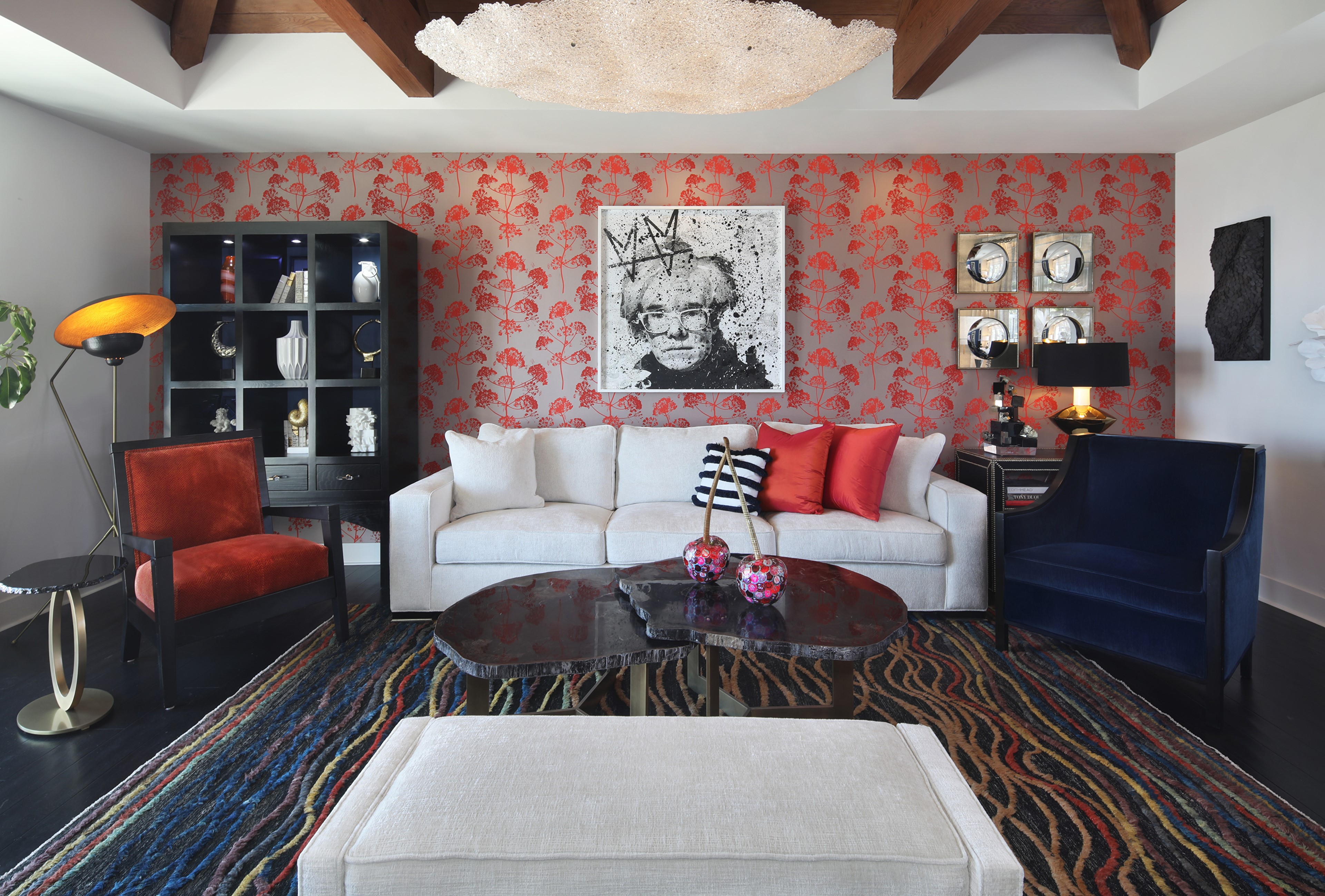 Living room with Andy Warhol portrait and red floral wallpaper HD Wallpaper