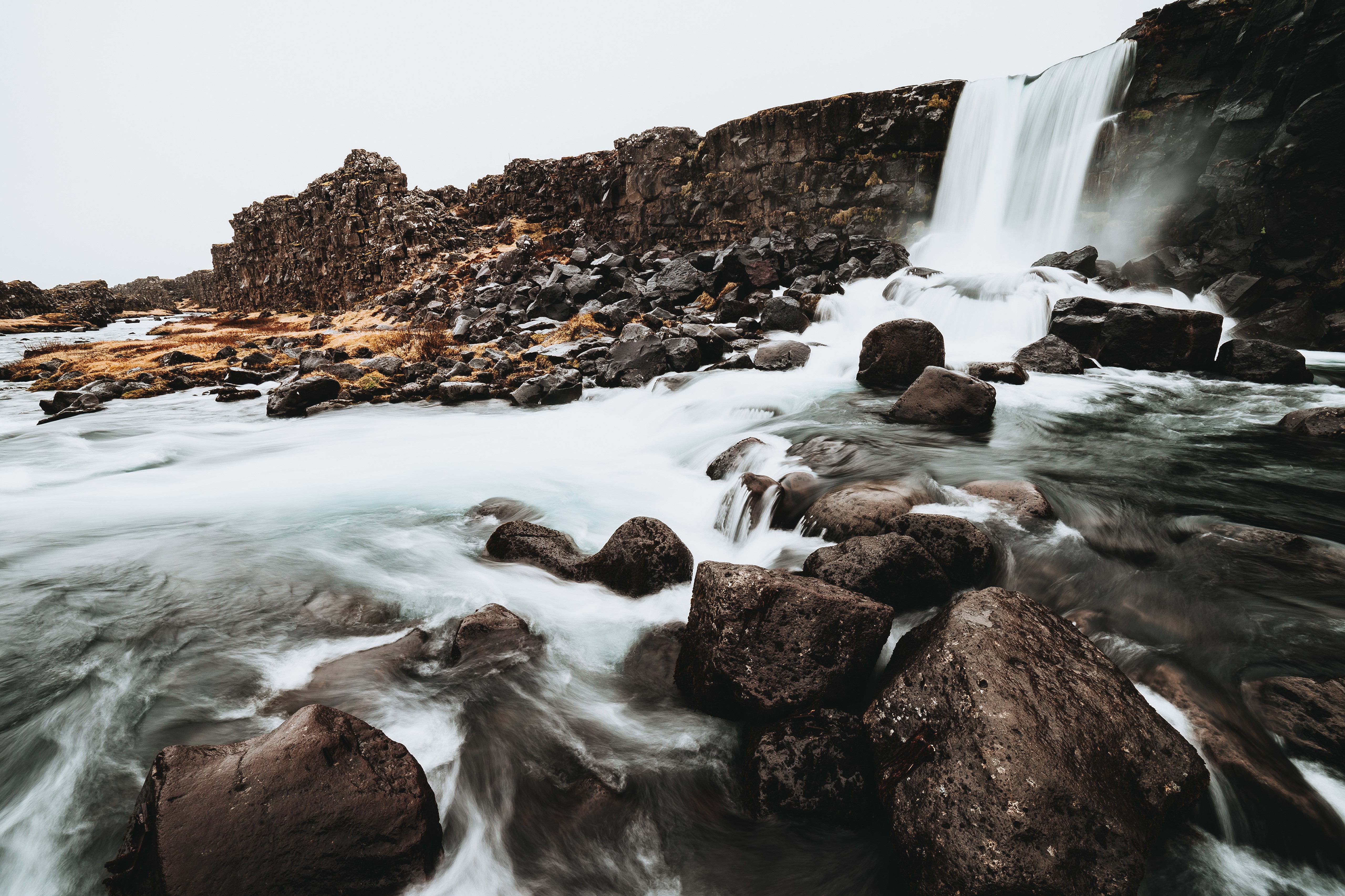 Waterfall and rocks in Iceland HD Wallpaper