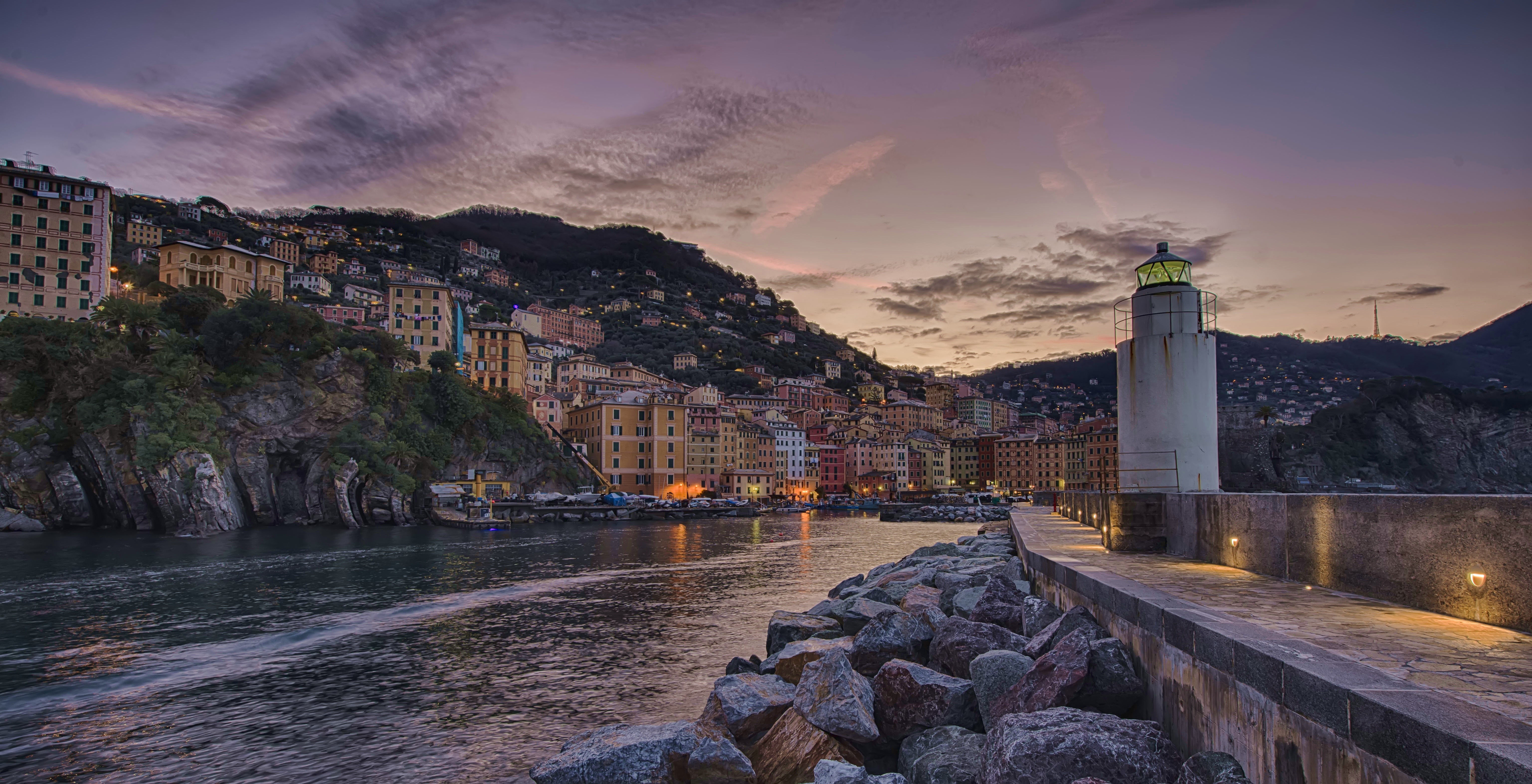 Camogli lighthouse and colorful houses at dusk, Italy HD Wallpaper