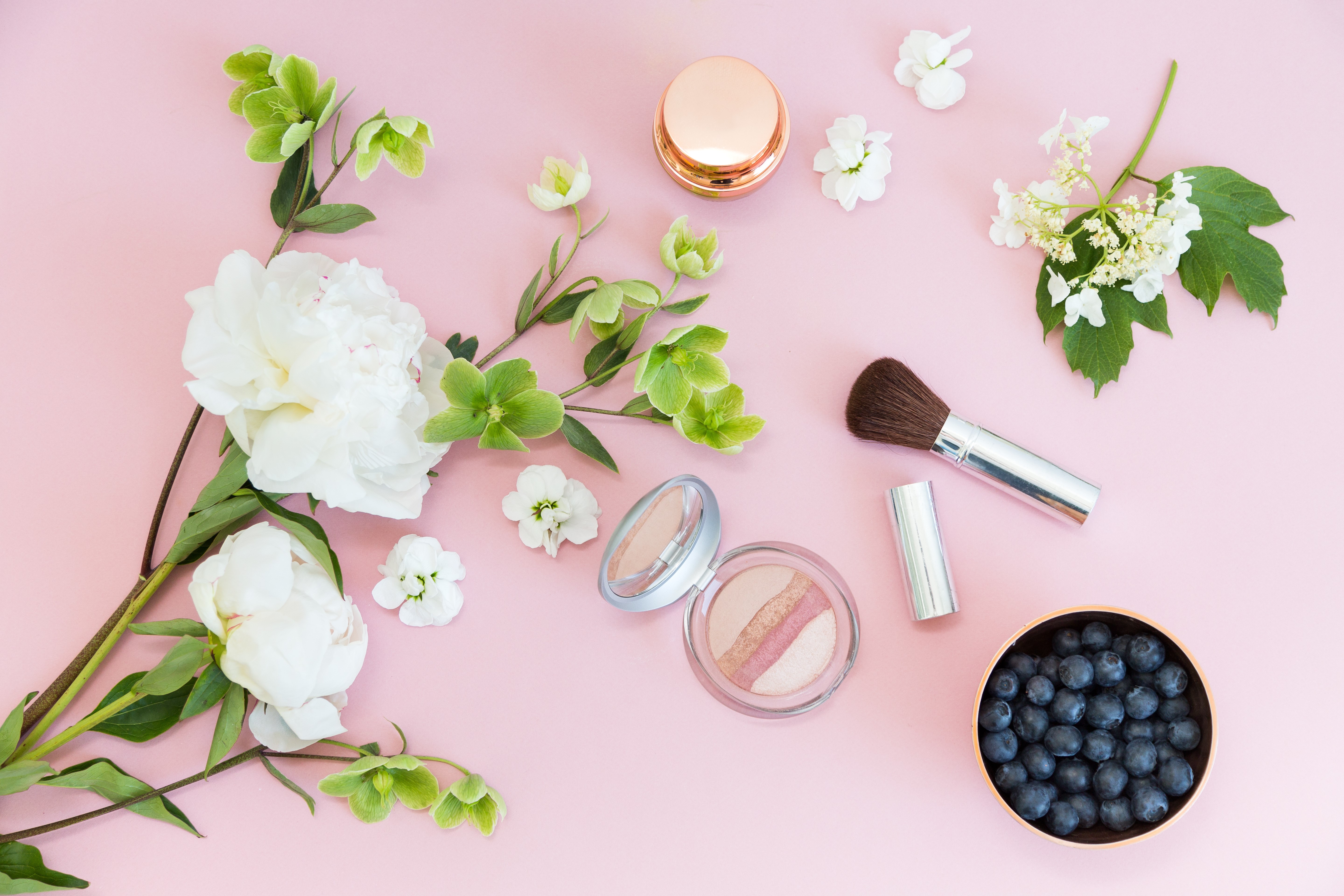 White Peonies, Blueberries, and Makeup on Pink Background HD Wallpaper