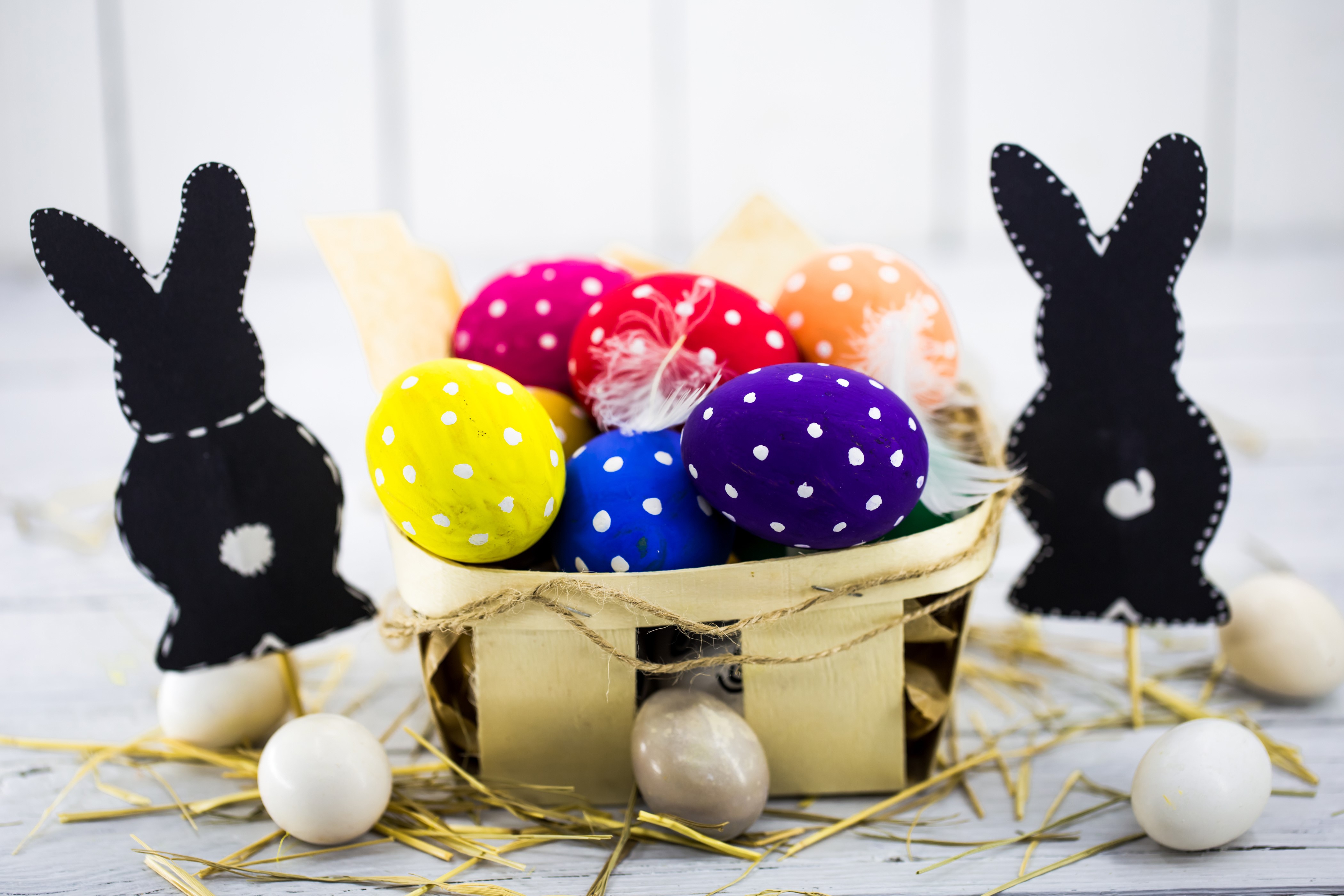 Easter eggs in a basket with black rabbits HD Wallpaper