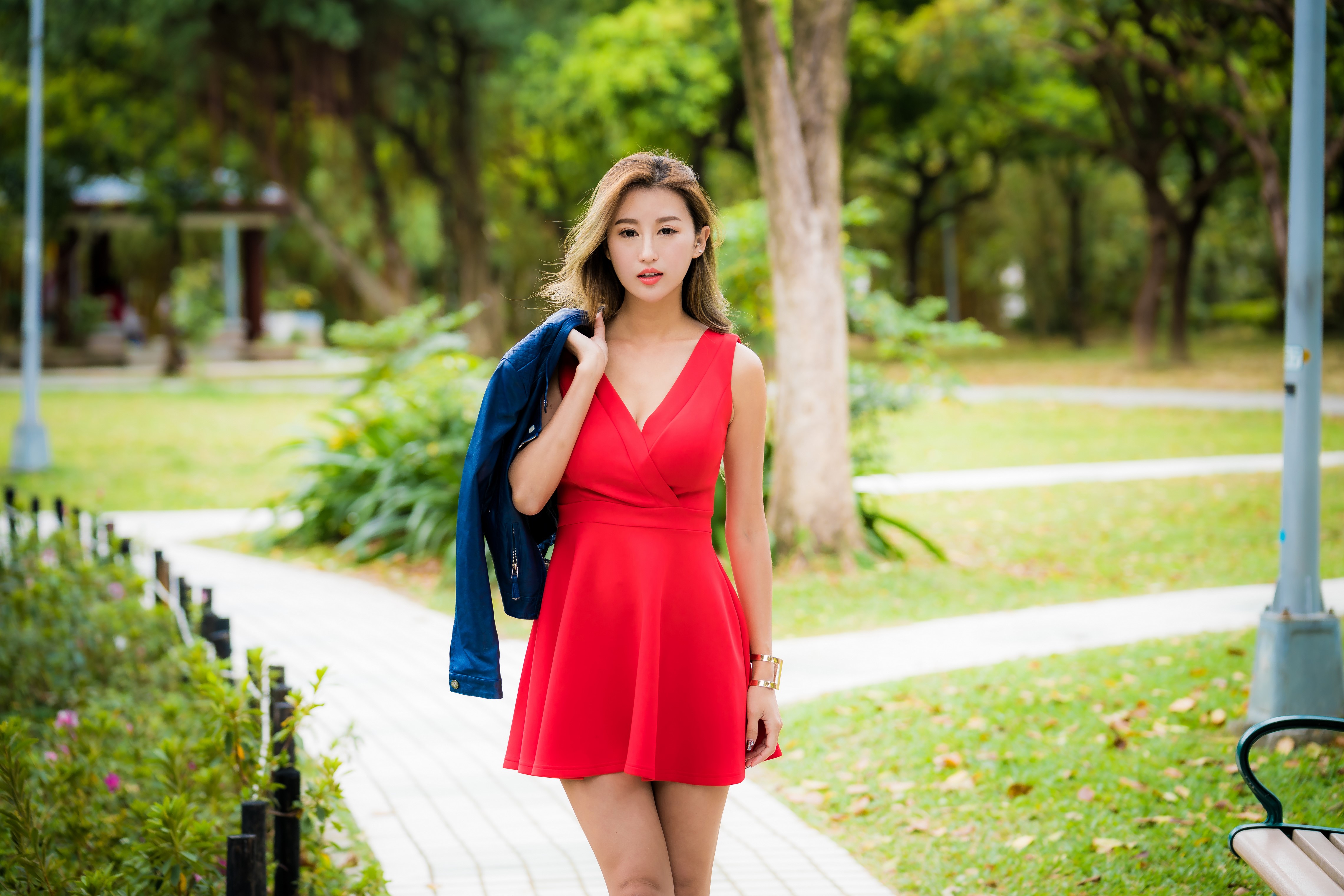 Asian woman in red dress holding jacket HD Wallpaper
