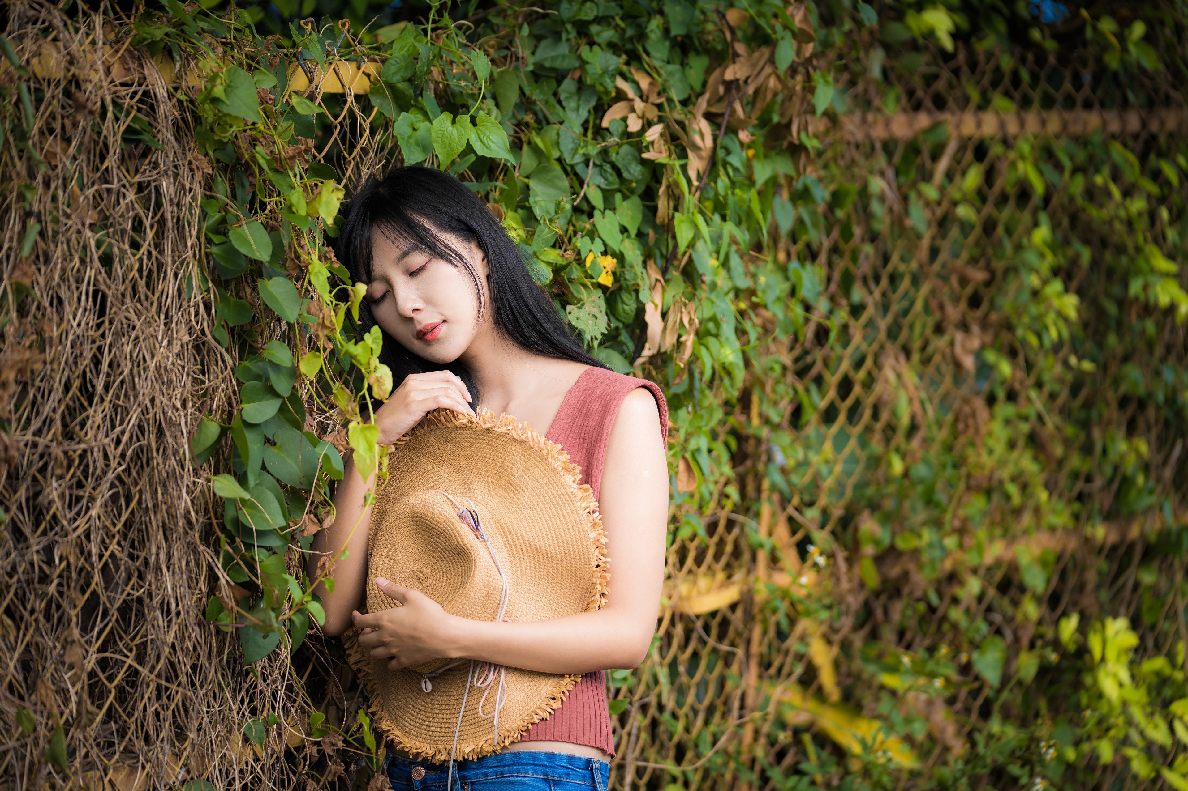 Brunette girl in singlet holding a hat HD Wallpaper