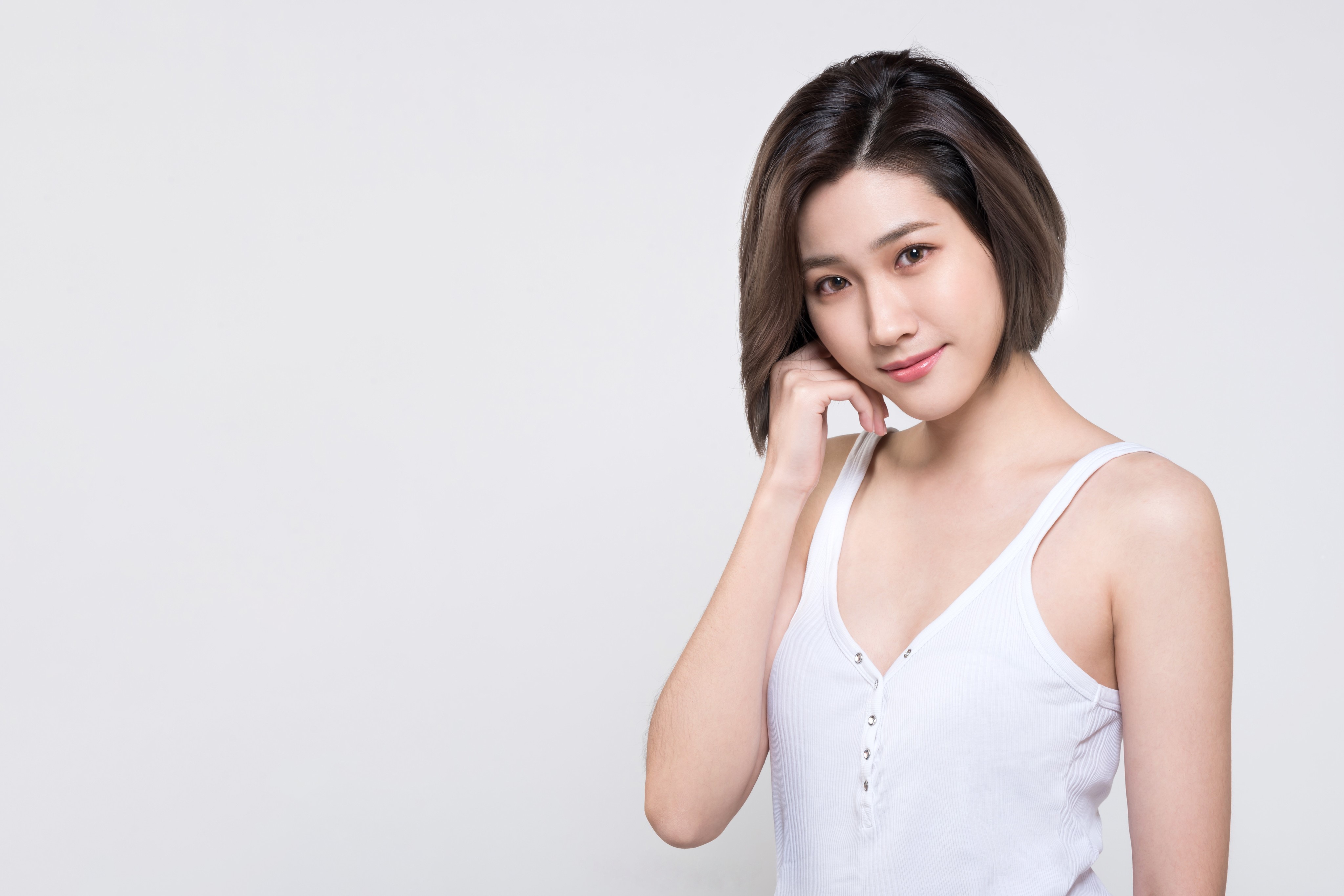 Asian woman in white singlet on gray background HD Wallpaper