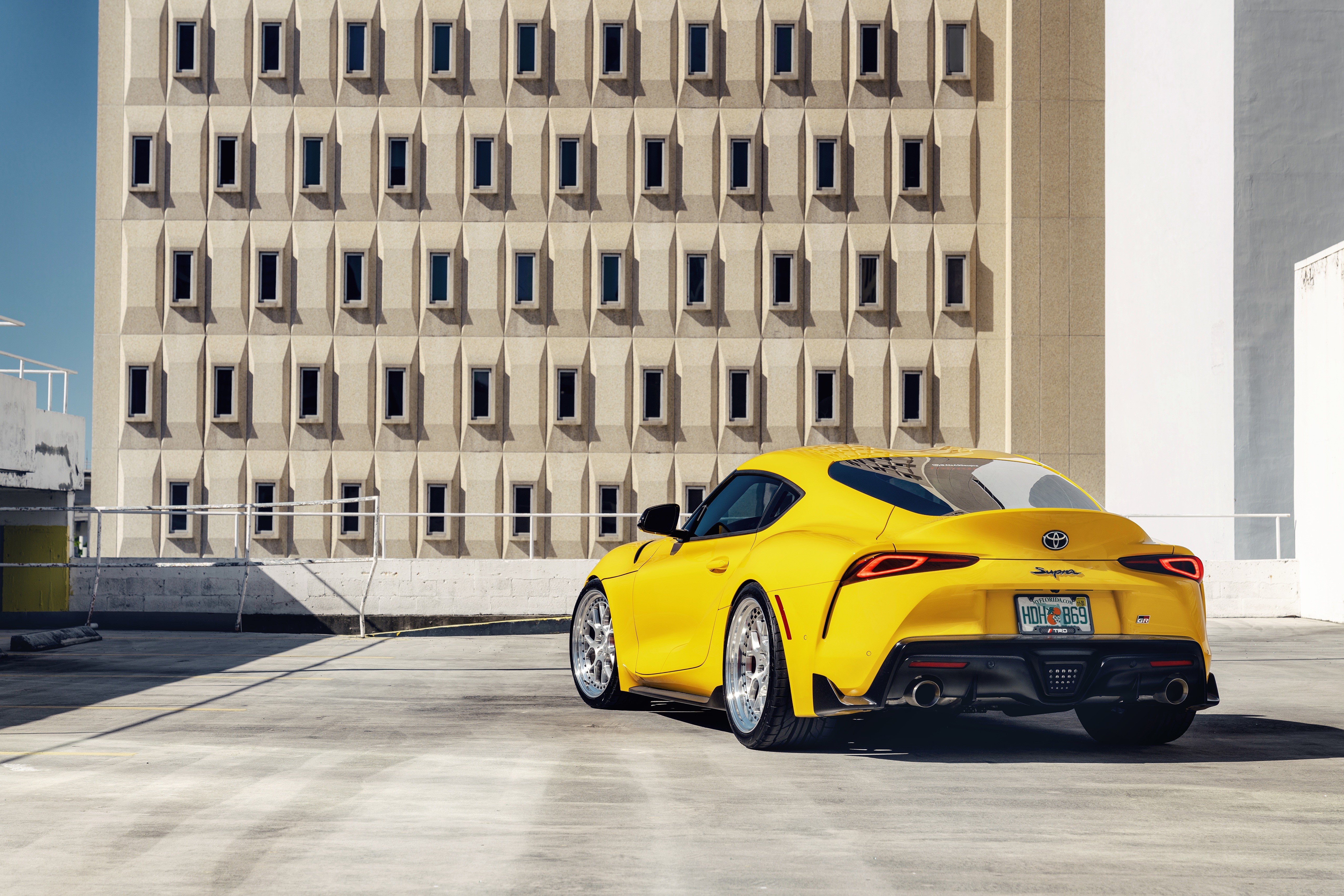 Yellow 2020 Toyota GR Supra from behind HD Wallpaper