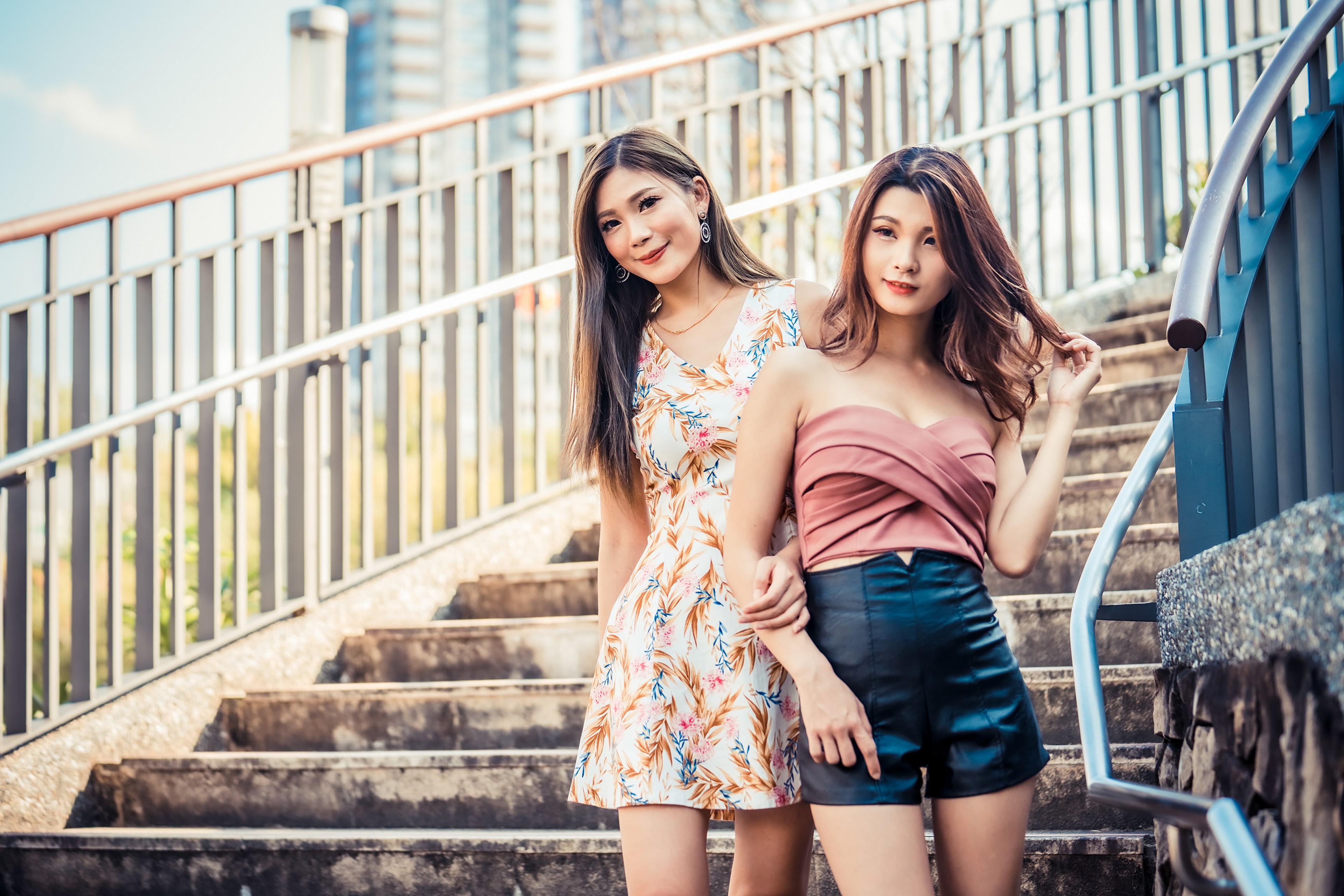 Two Asian women on stairs HD Wallpaper