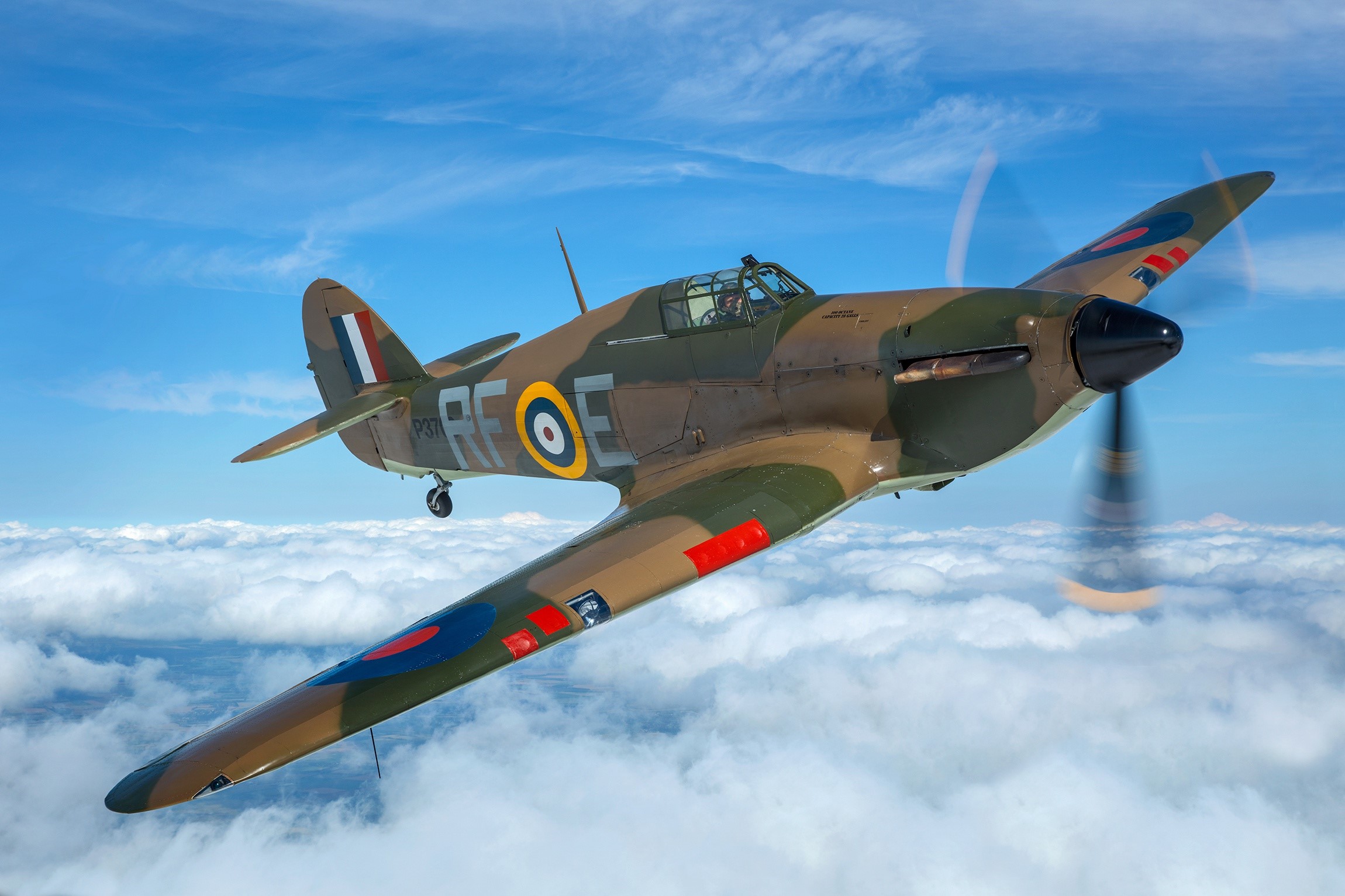 Hawker Hurricane MK1 flying through clouds HD Wallpaper