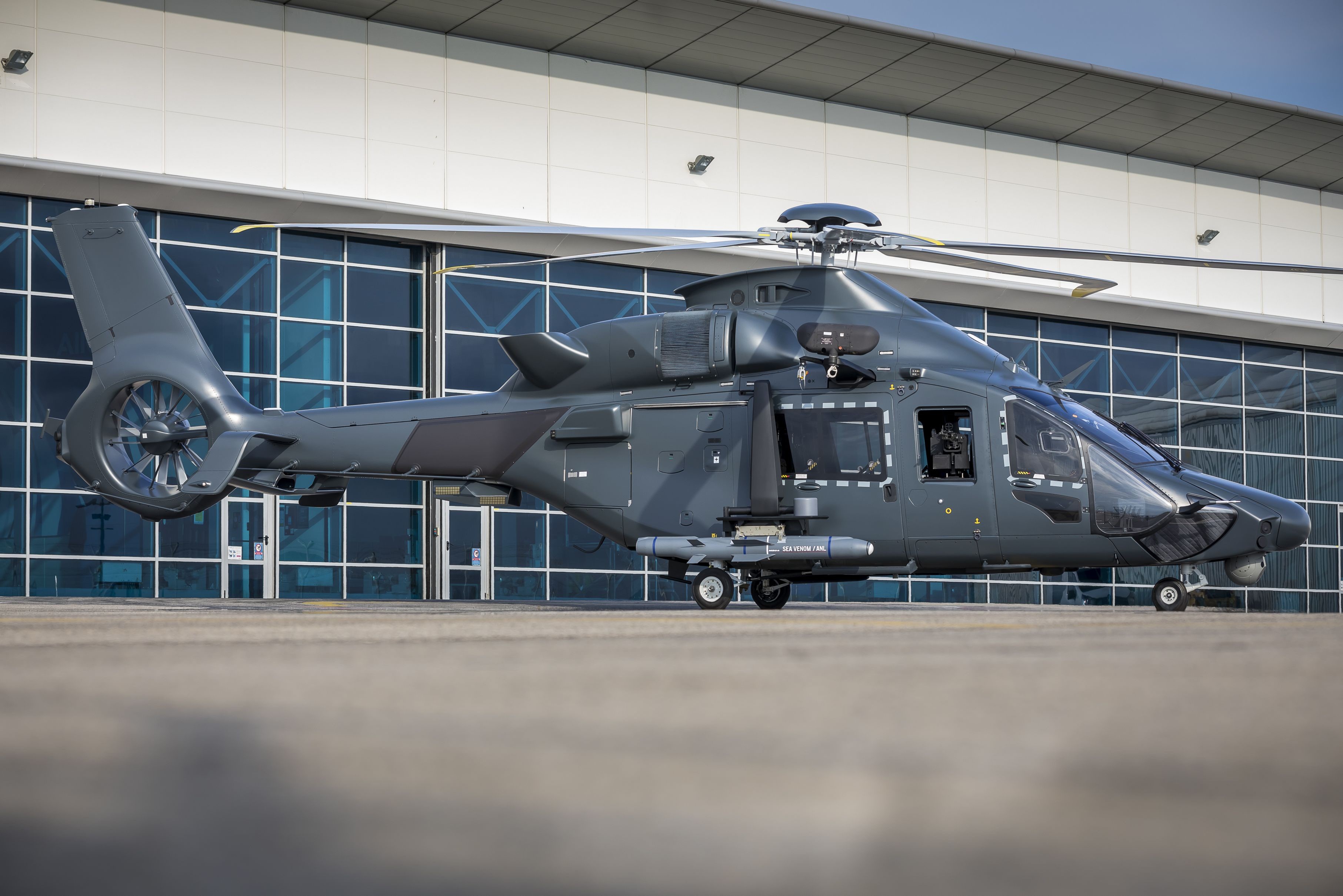 Airbus H160M Guepard helicopter on tarmac HD Wallpaper