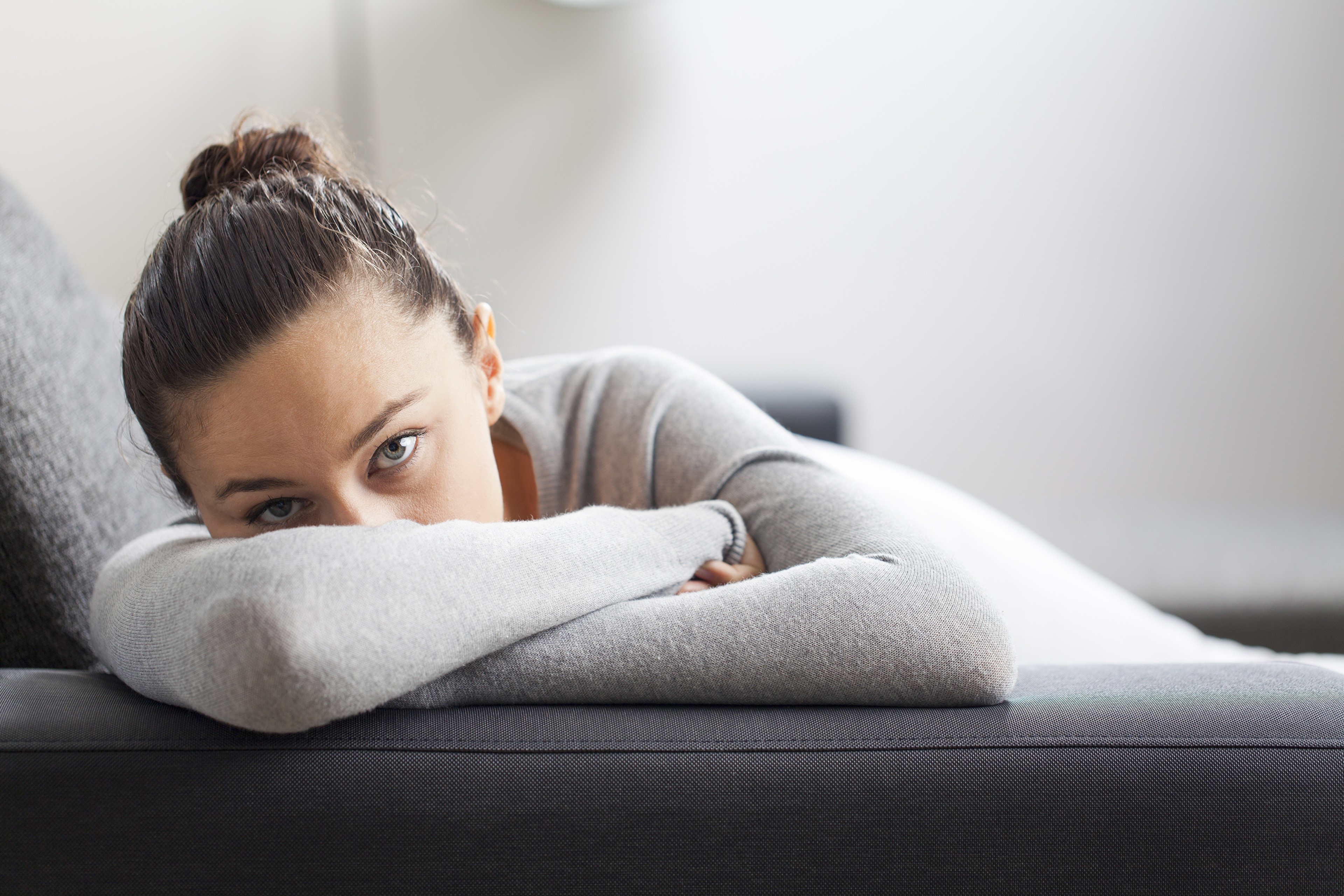 Woman lying on a sofa HD Wallpaper
