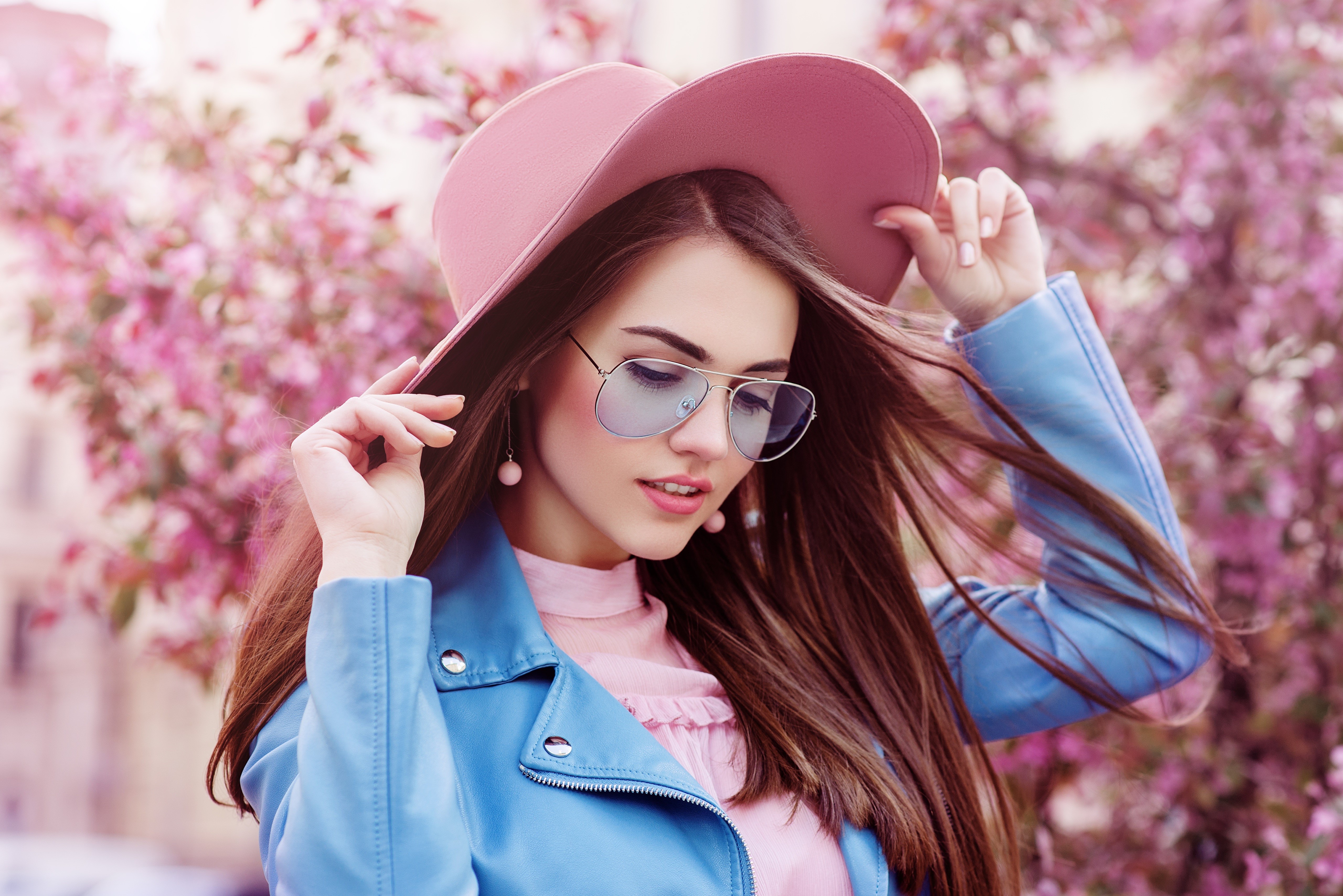 Brown haired woman wearing a pink hat and blue jacket HD Wallpaper