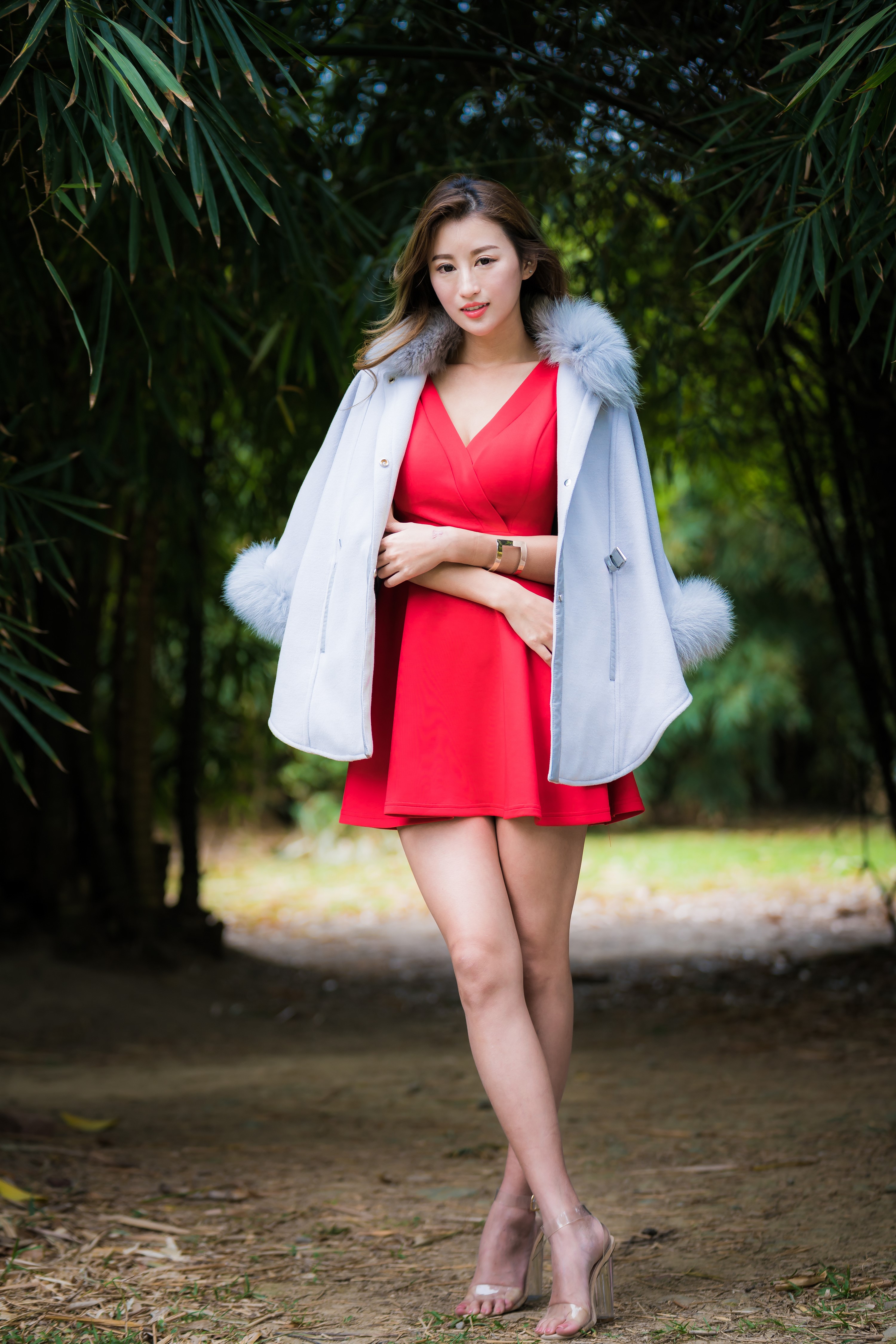 Asian woman in red dress and fur-trimmed coat HD Phone Wallpaper