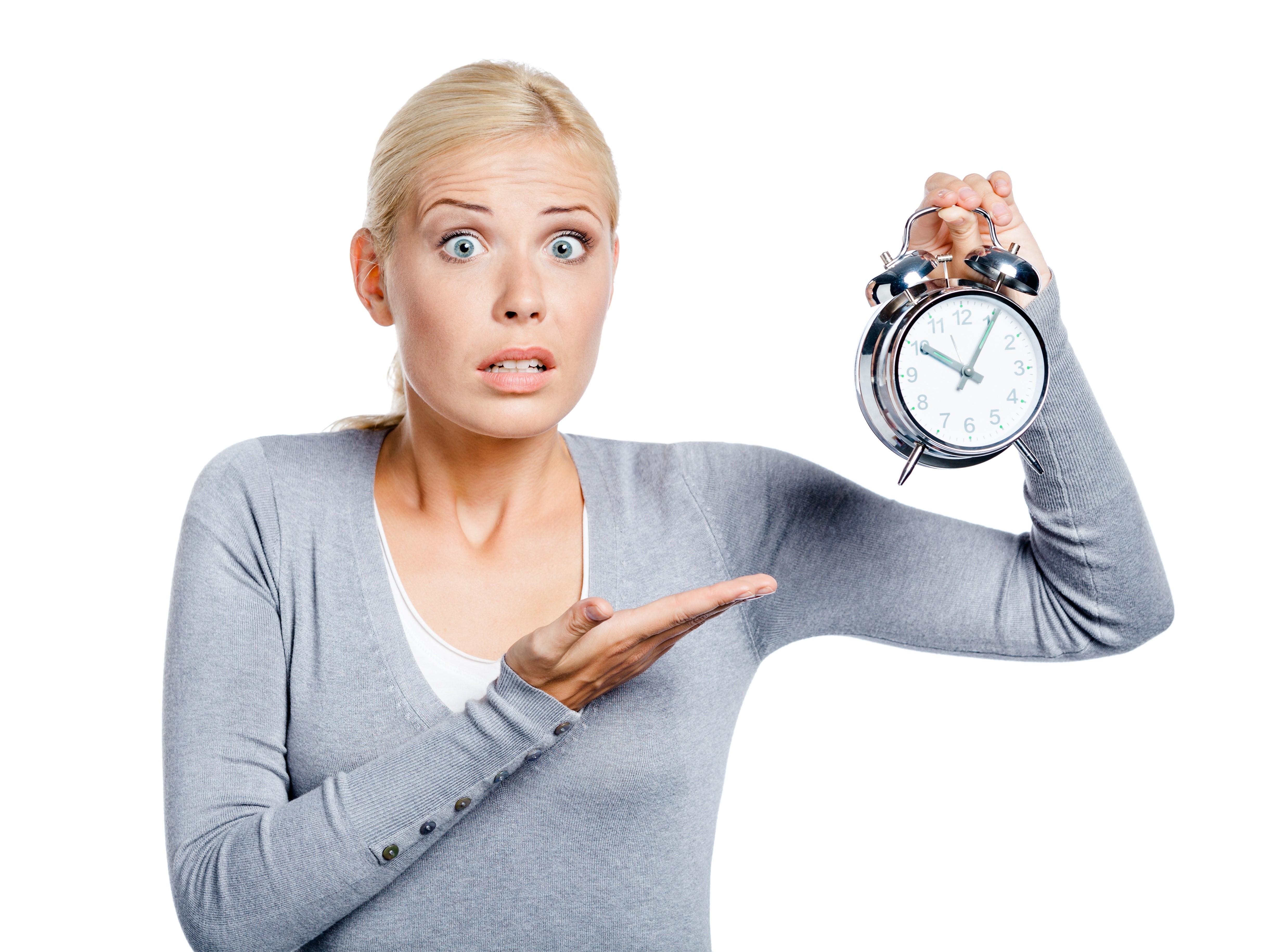 Woman holding an alarm clock with surprise HD Wallpaper