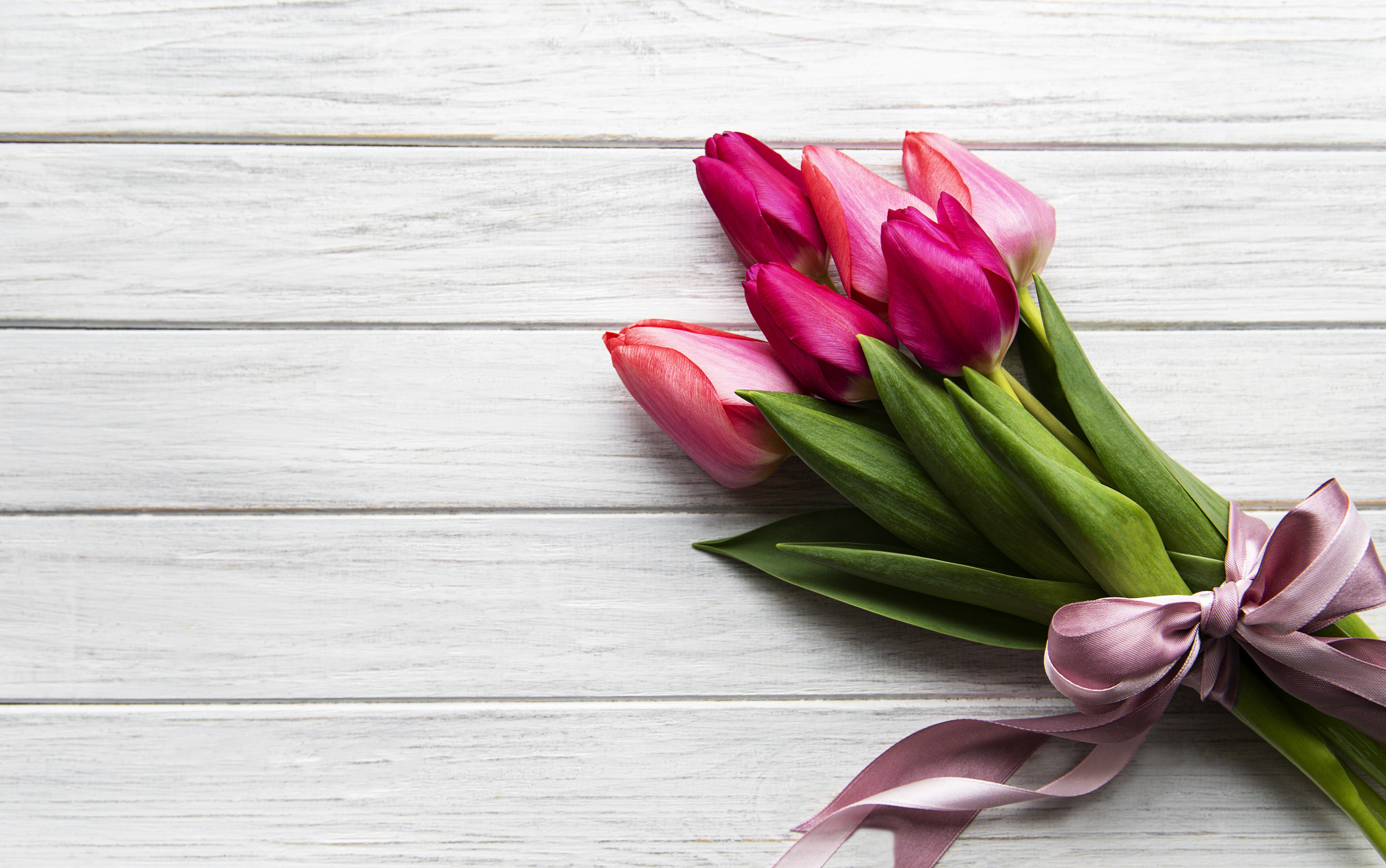 Bouquet of pink and purple tulips on wood planks HD Wallpaper