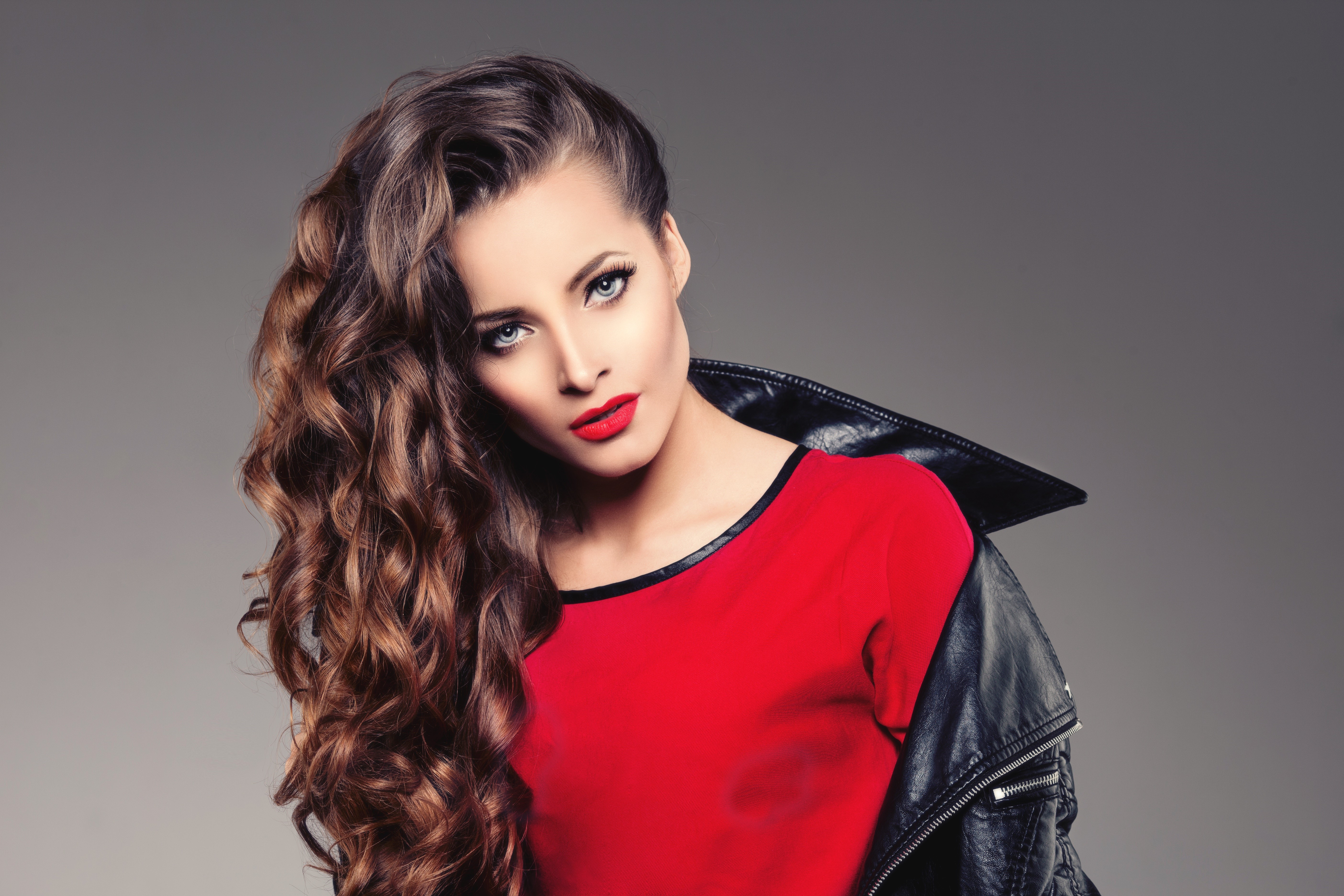 Model with brown curly hair and red lips HD Wallpaper