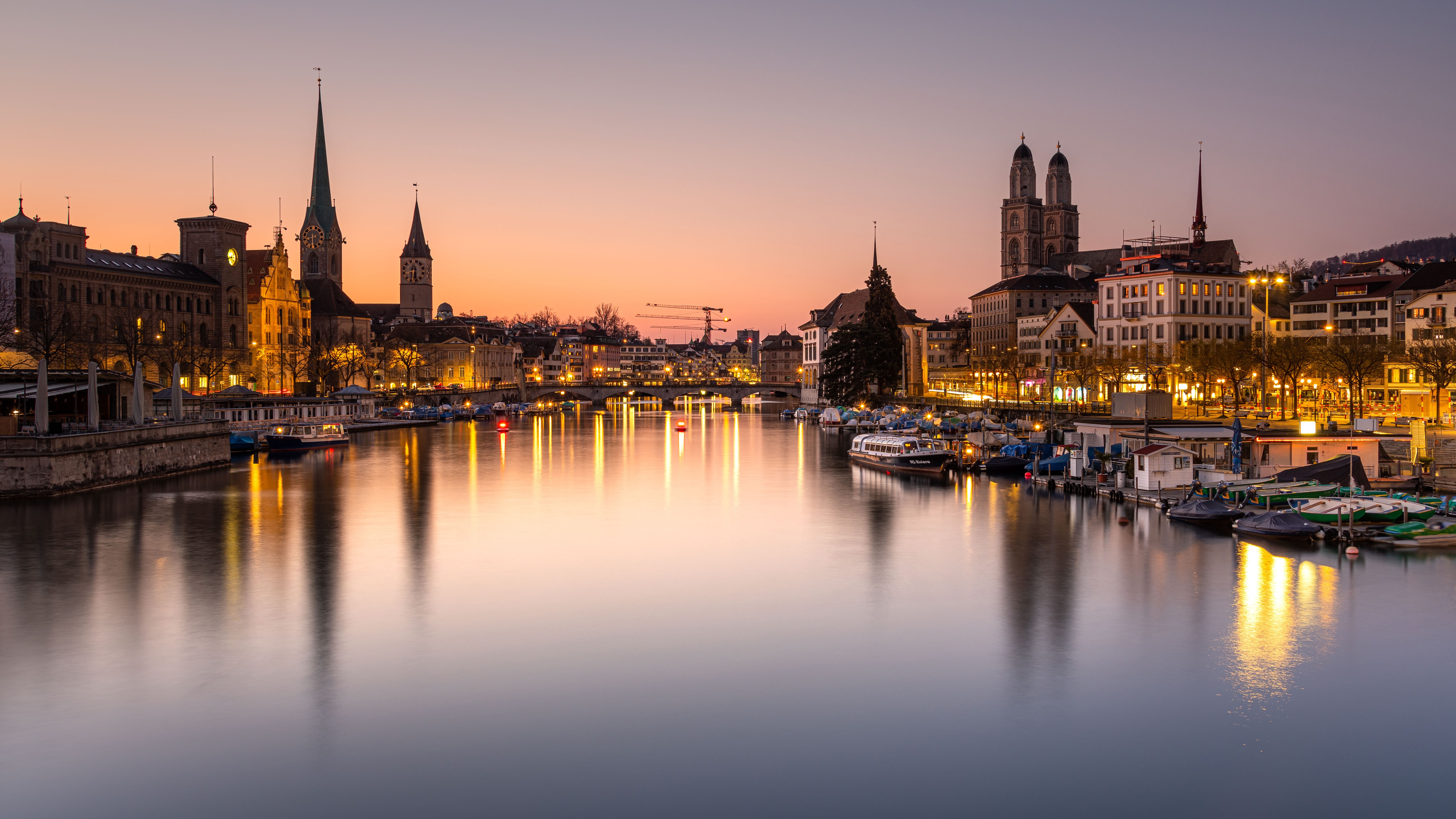 Zurich, Switzerland at dusk with river and buildings HD Wallpaper
