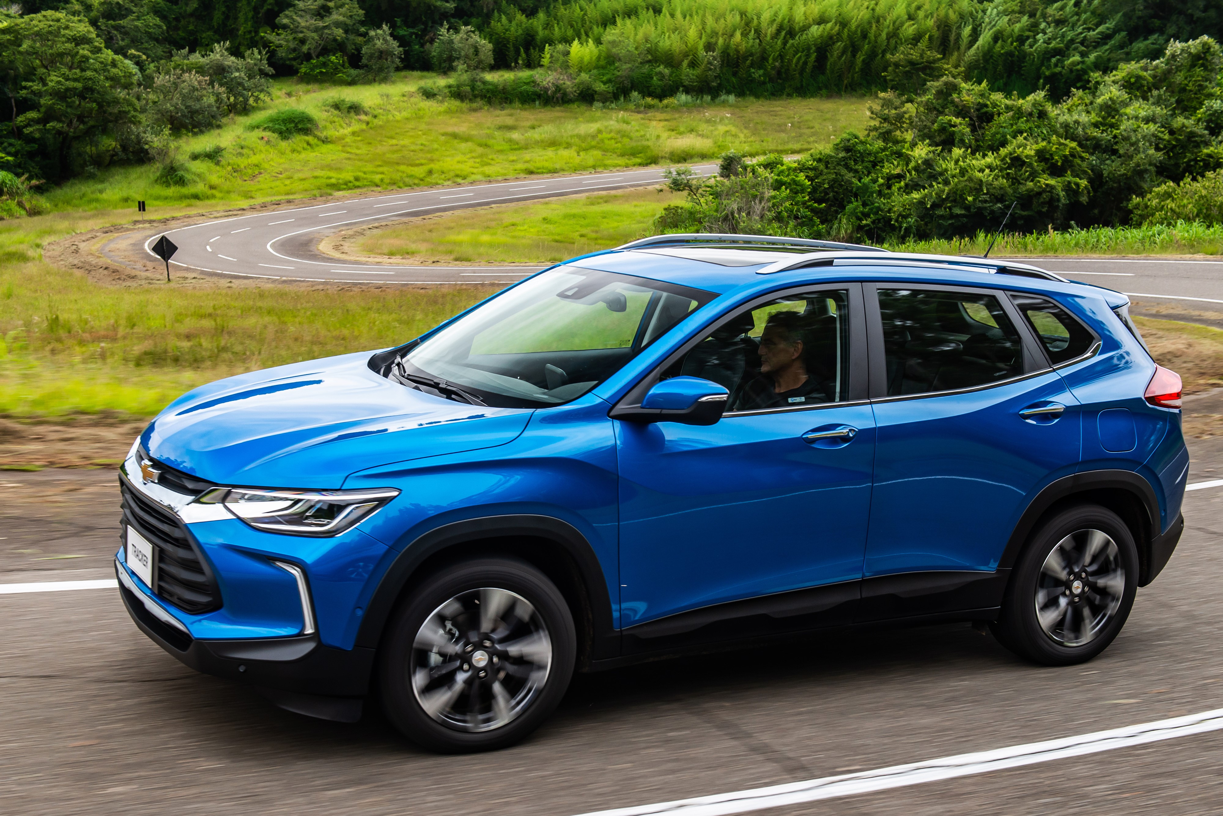 Chevrolet Tracker Premier driving on a winding road HD Wallpaper