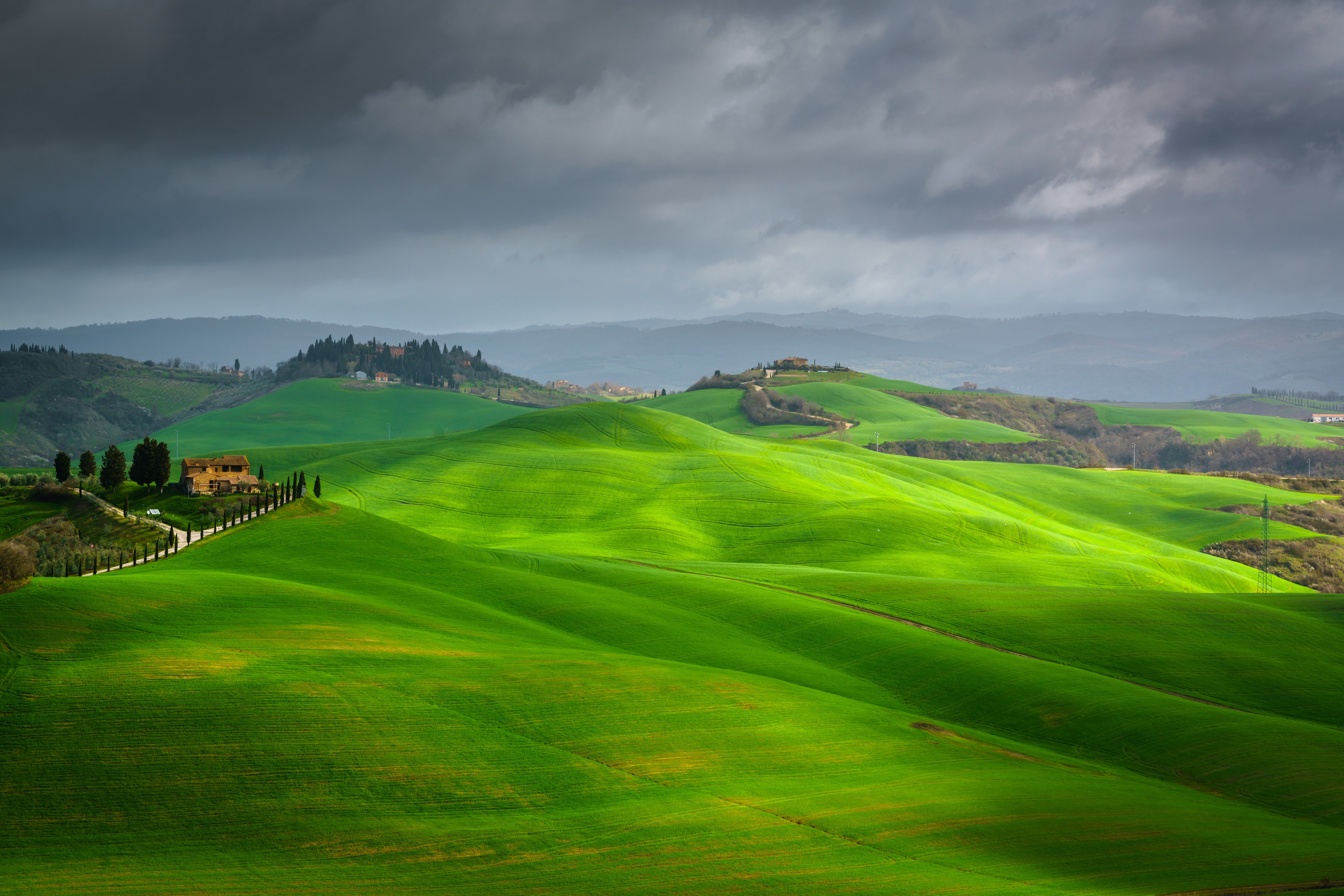 Tuscany landscape with rolling green hills and clouds HD Wallpaper