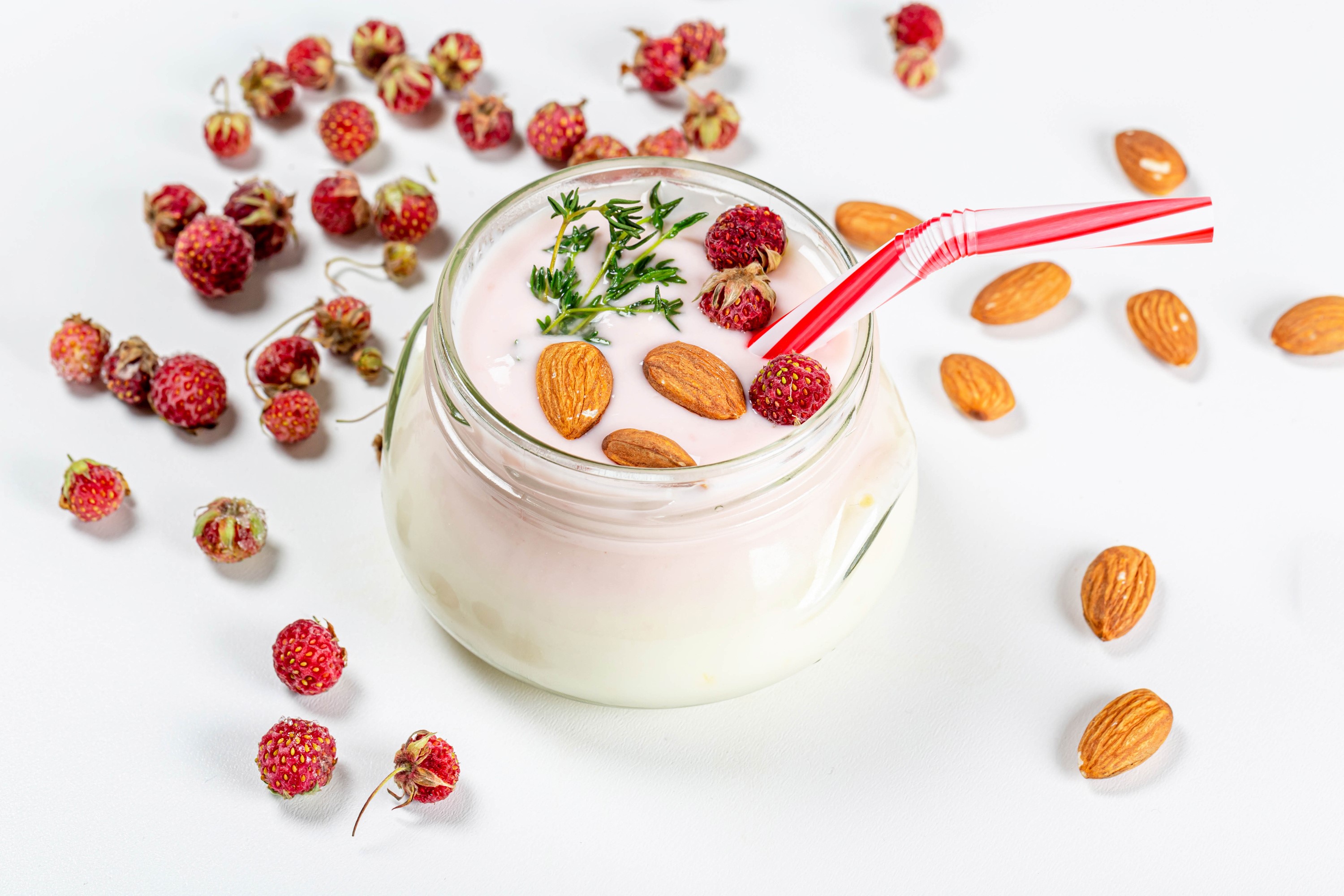 Yogurt with strawberries and almonds in a jar HD Wallpaper