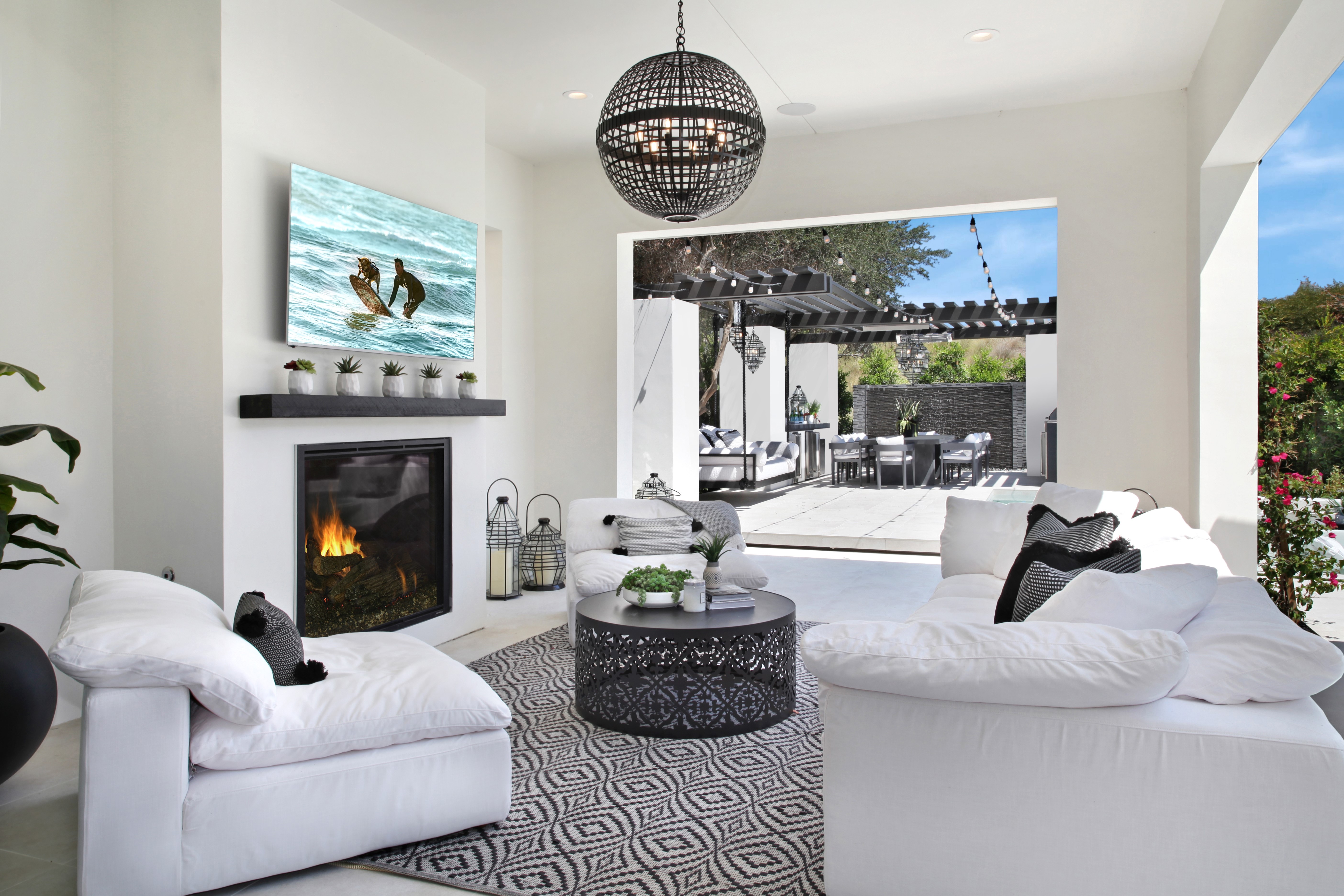 Living room with fireplace and outdoor patio HD Wallpaper