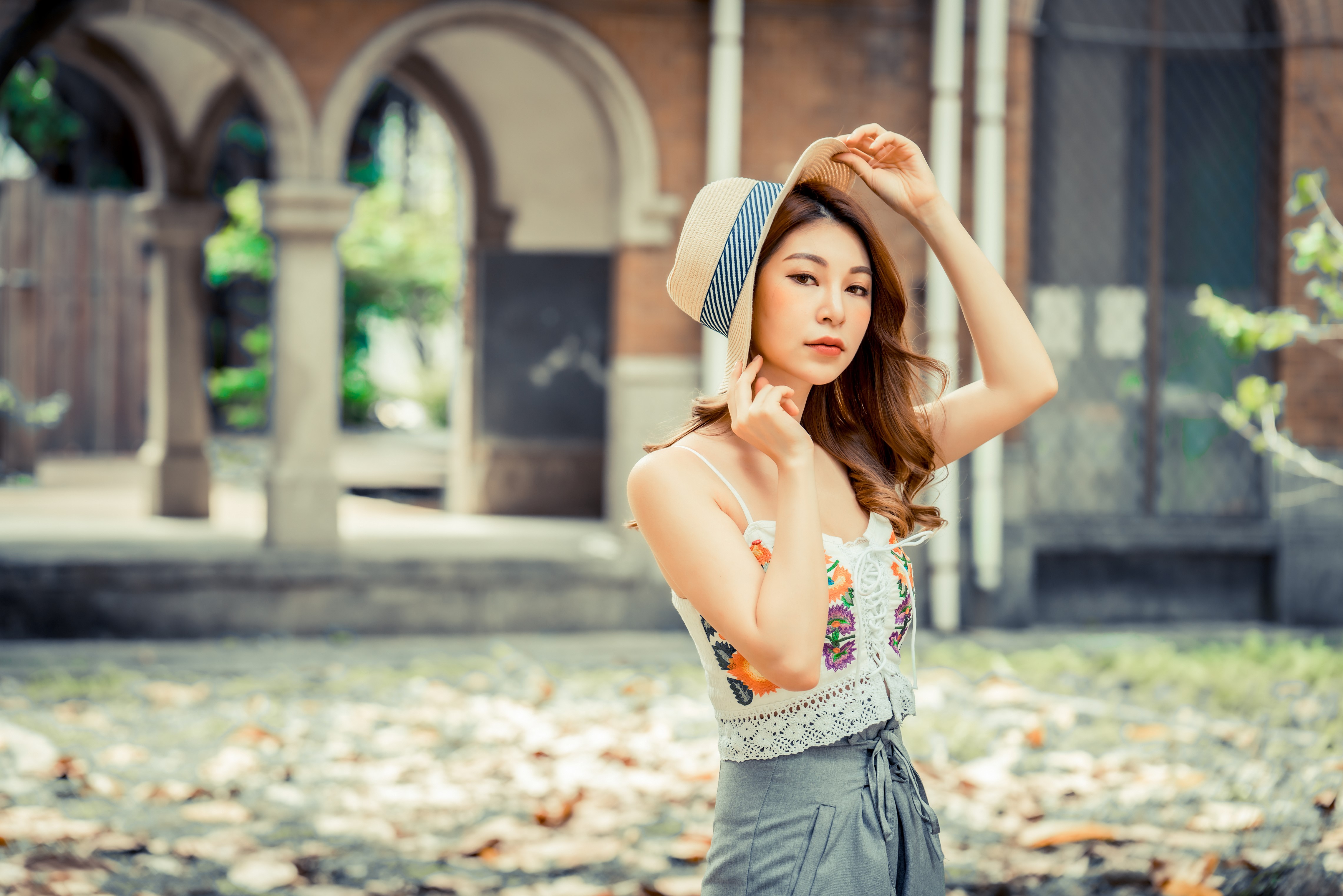 Asian woman with brown hair wearing a hat HD Wallpaper