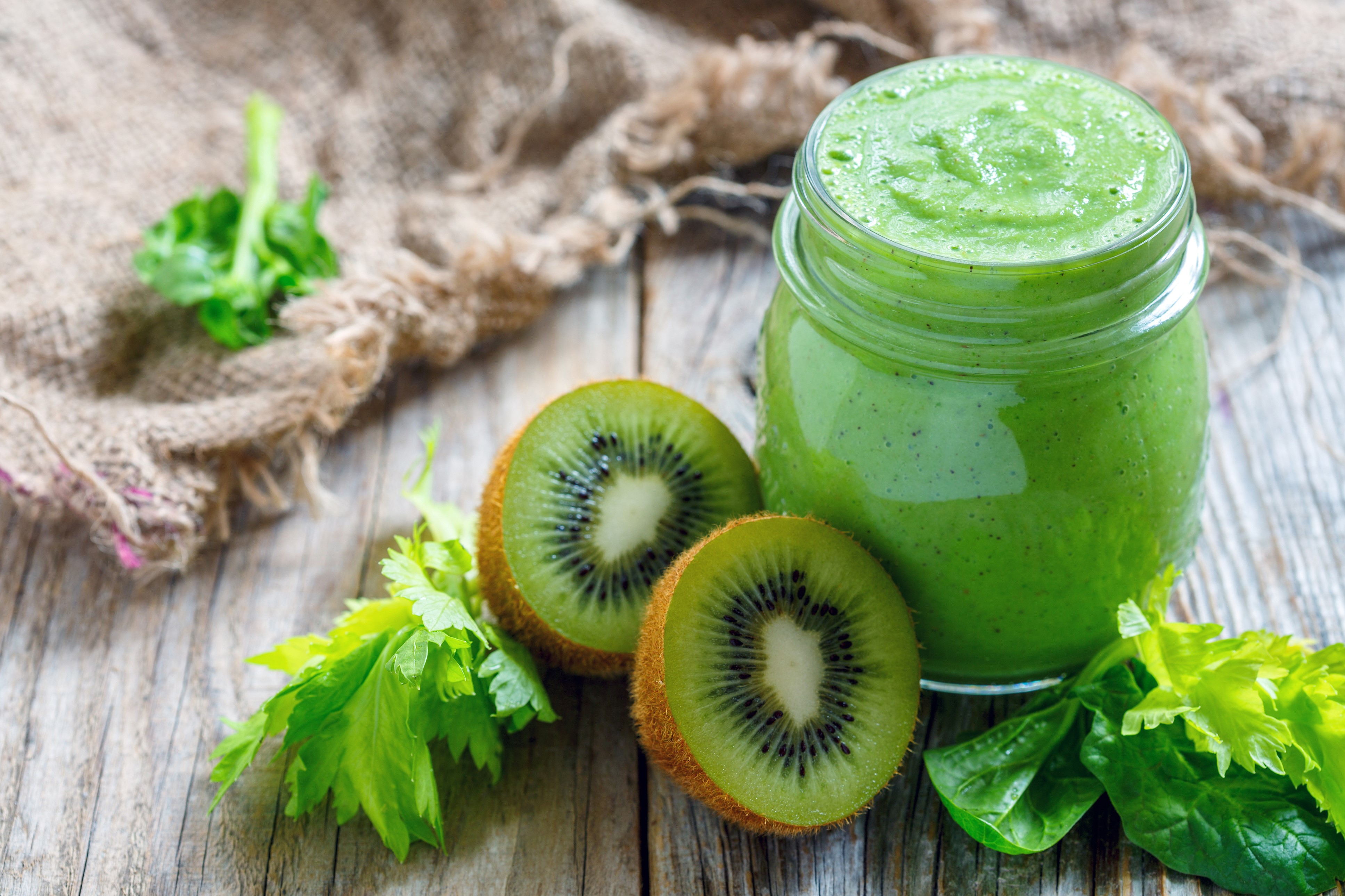 Green smoothie in a jar with kiwi and celery HD Wallpaper