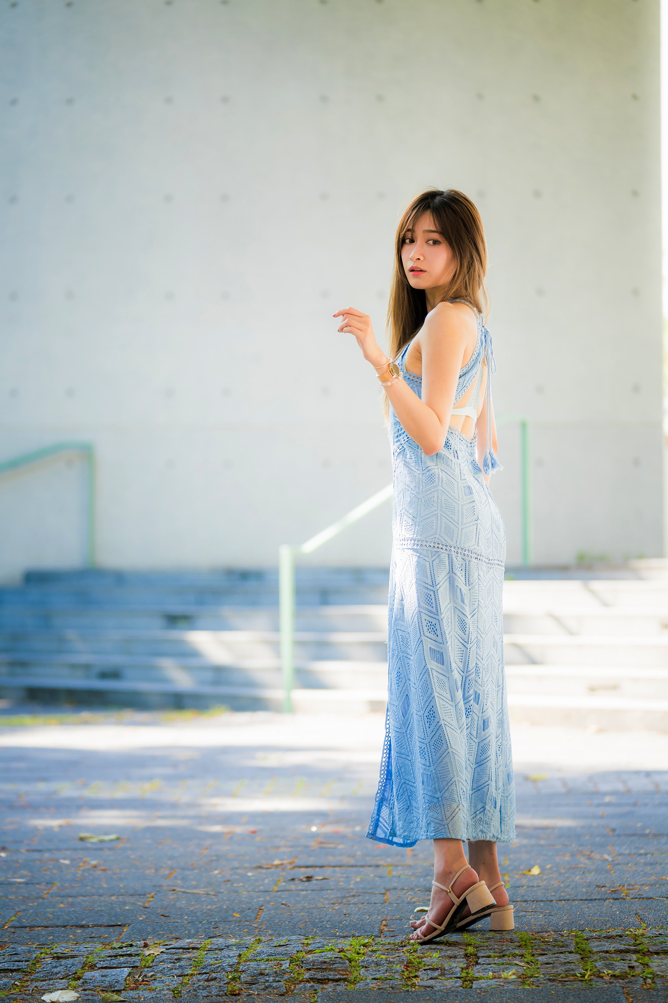 Asian woman in a blue dress looking over her shoulder HD Phone Wallpaper