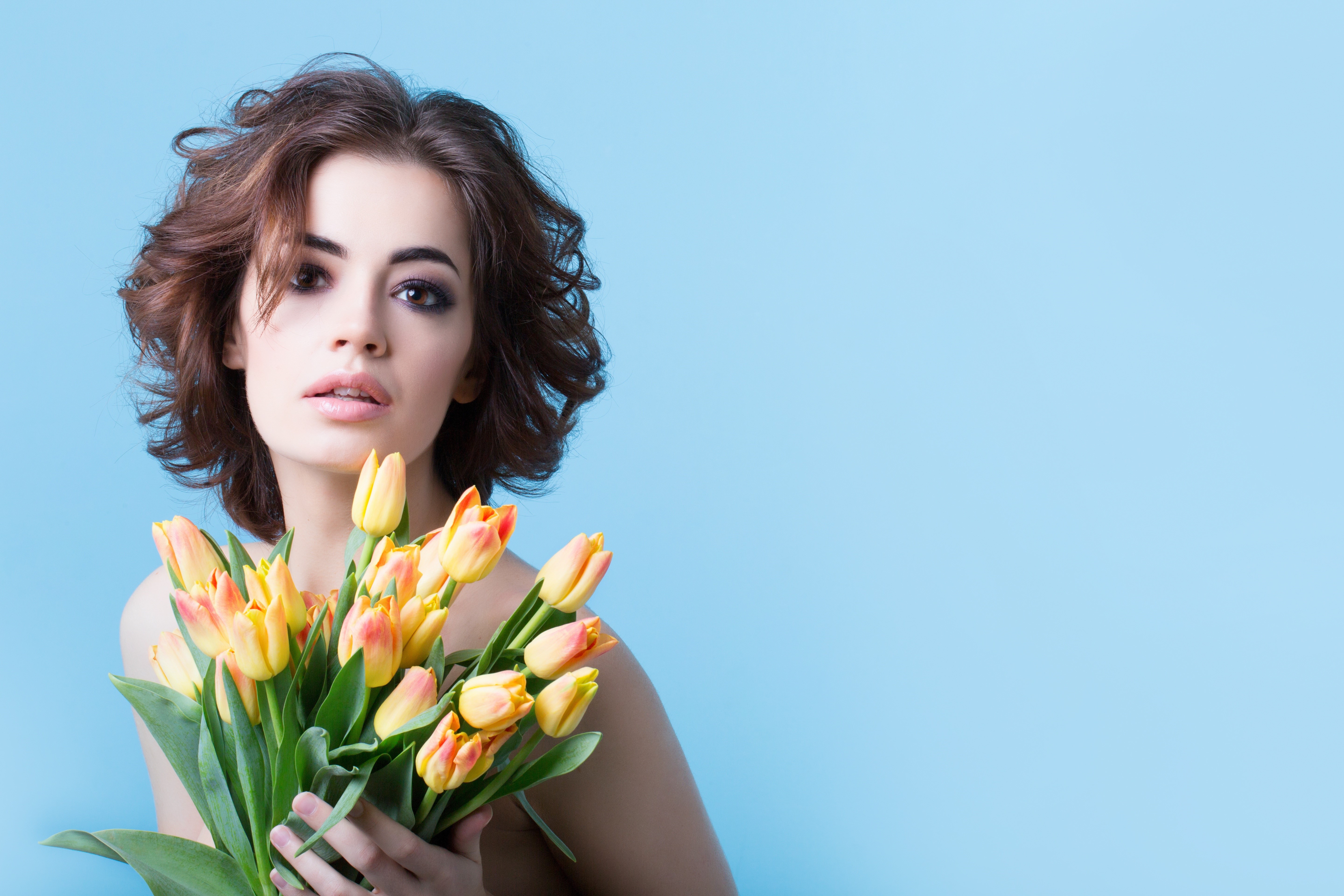 Model with Brown Hair Holding Tulips HD Wallpaper