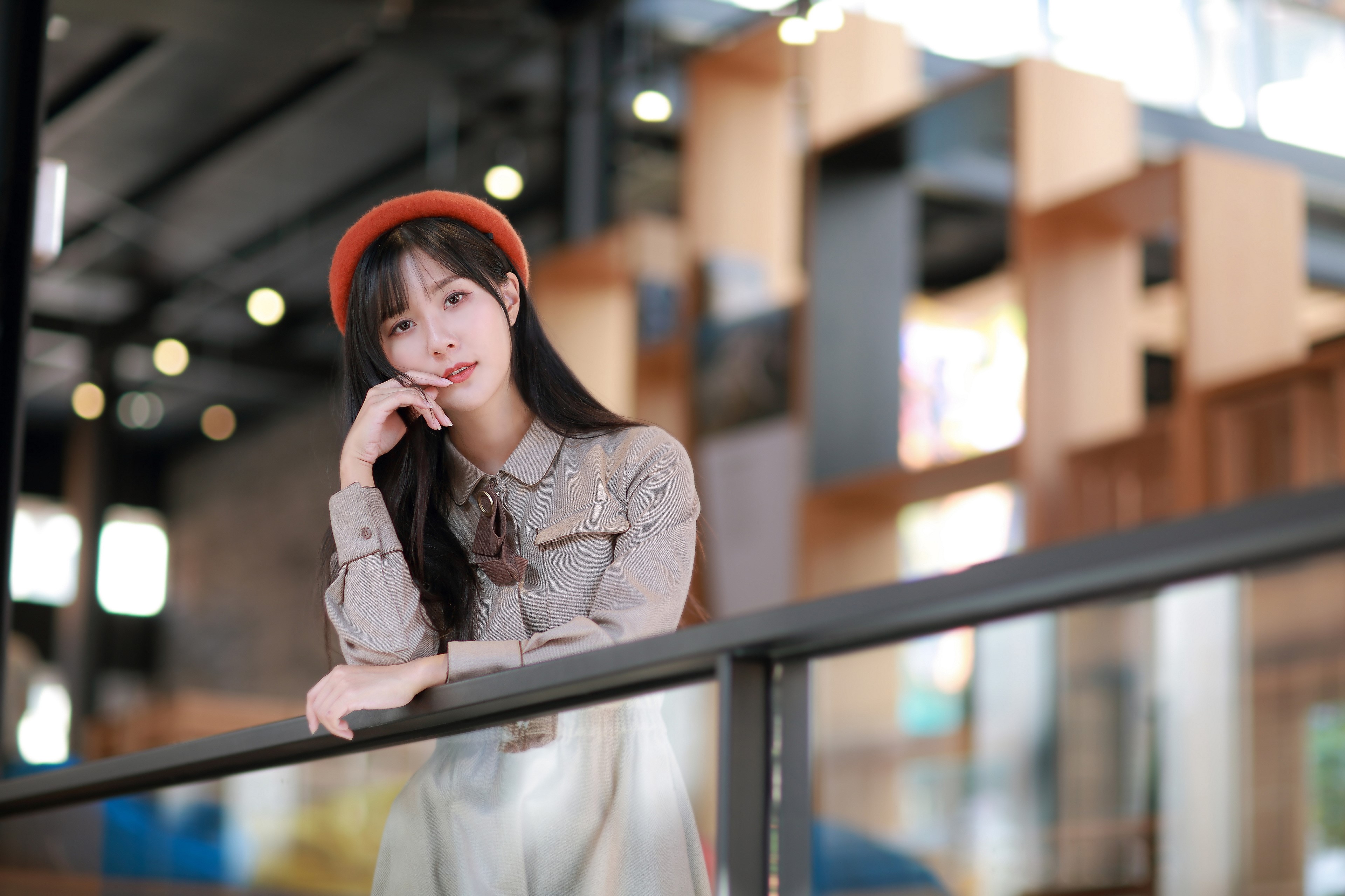 Asian girl with beret in a cafe HD Wallpaper