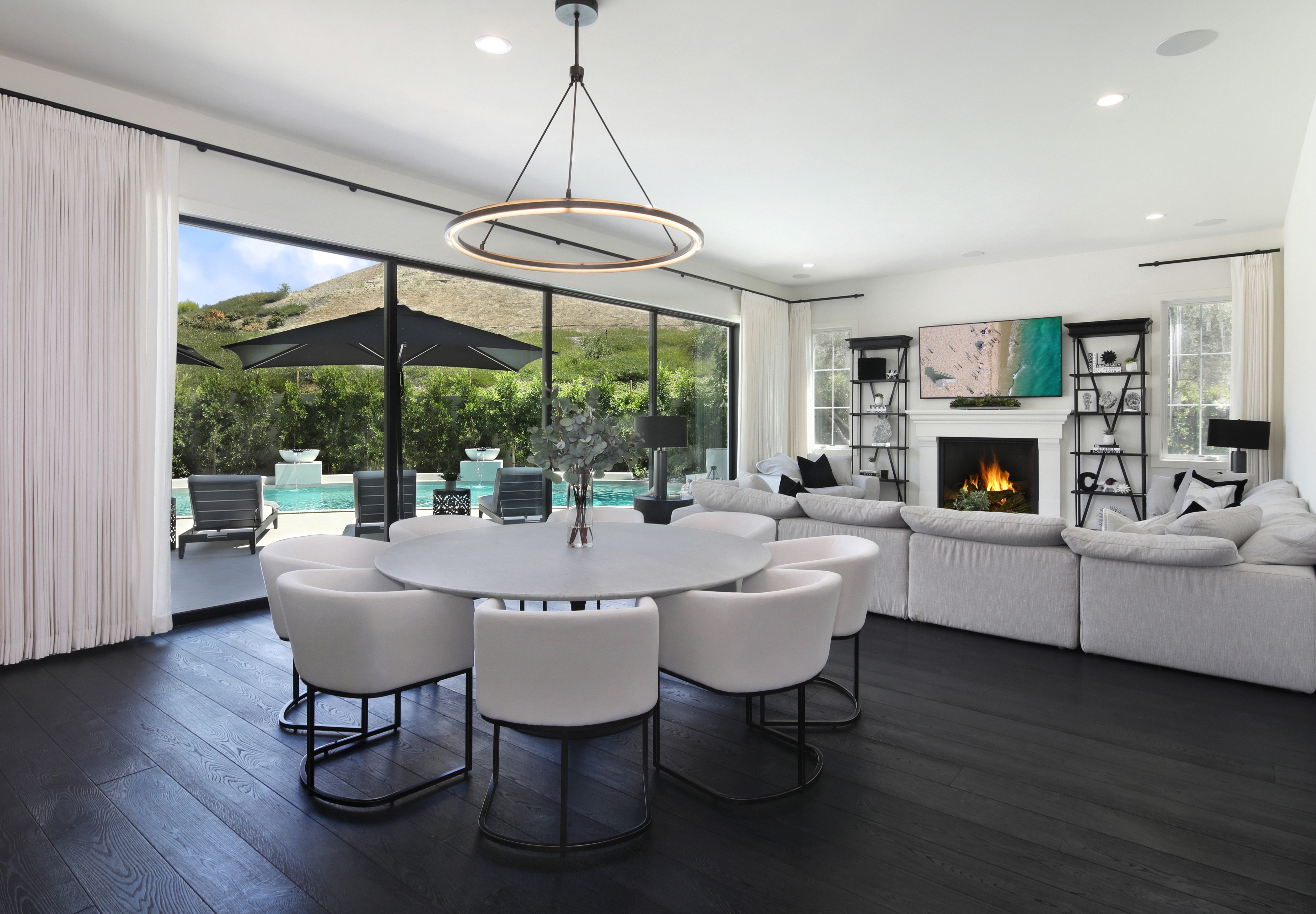 Modern Living Room with Dining Area and Pool View HD Wallpaper