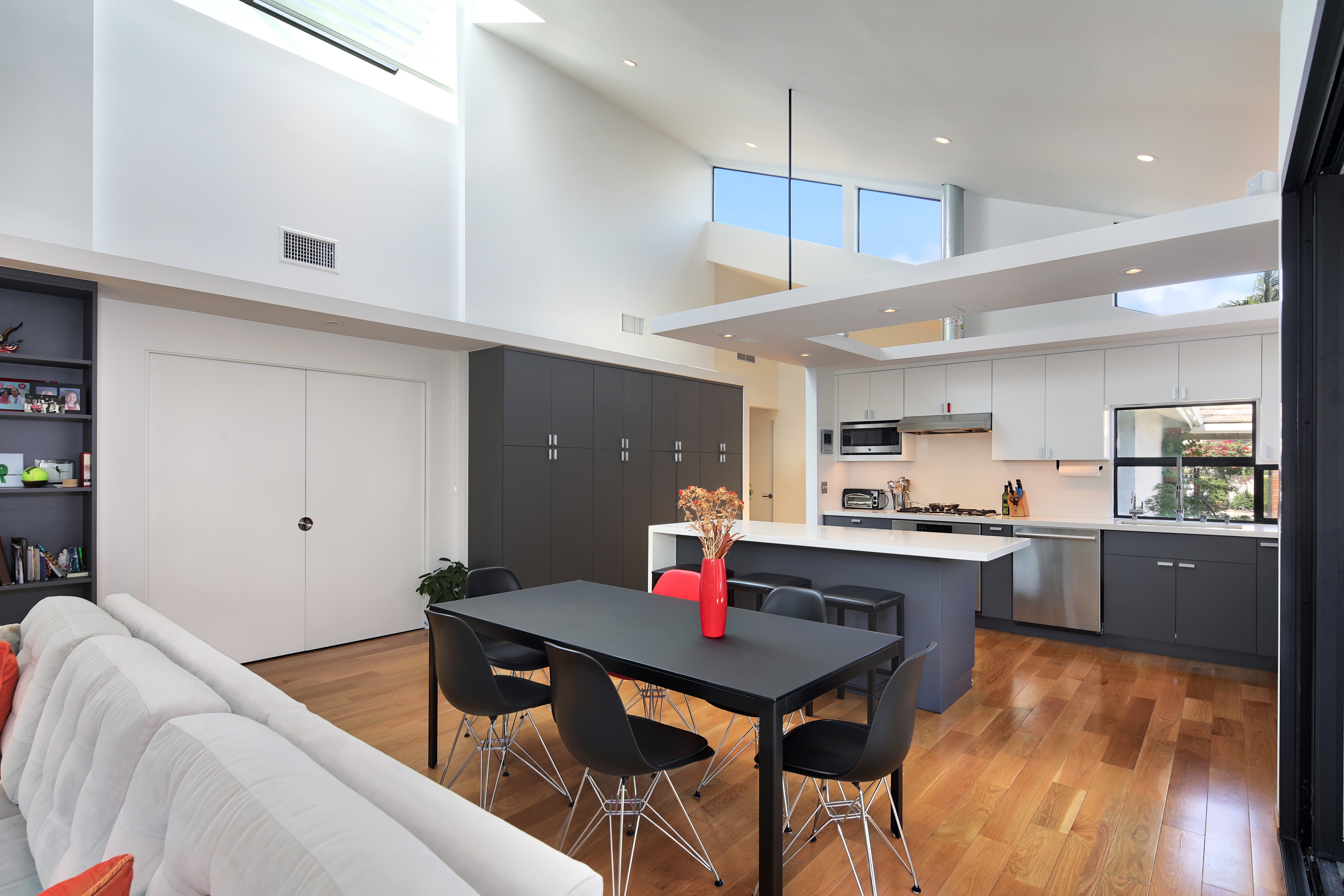 Modern Kitchen and Dining Area with High Ceilings HD Wallpaper