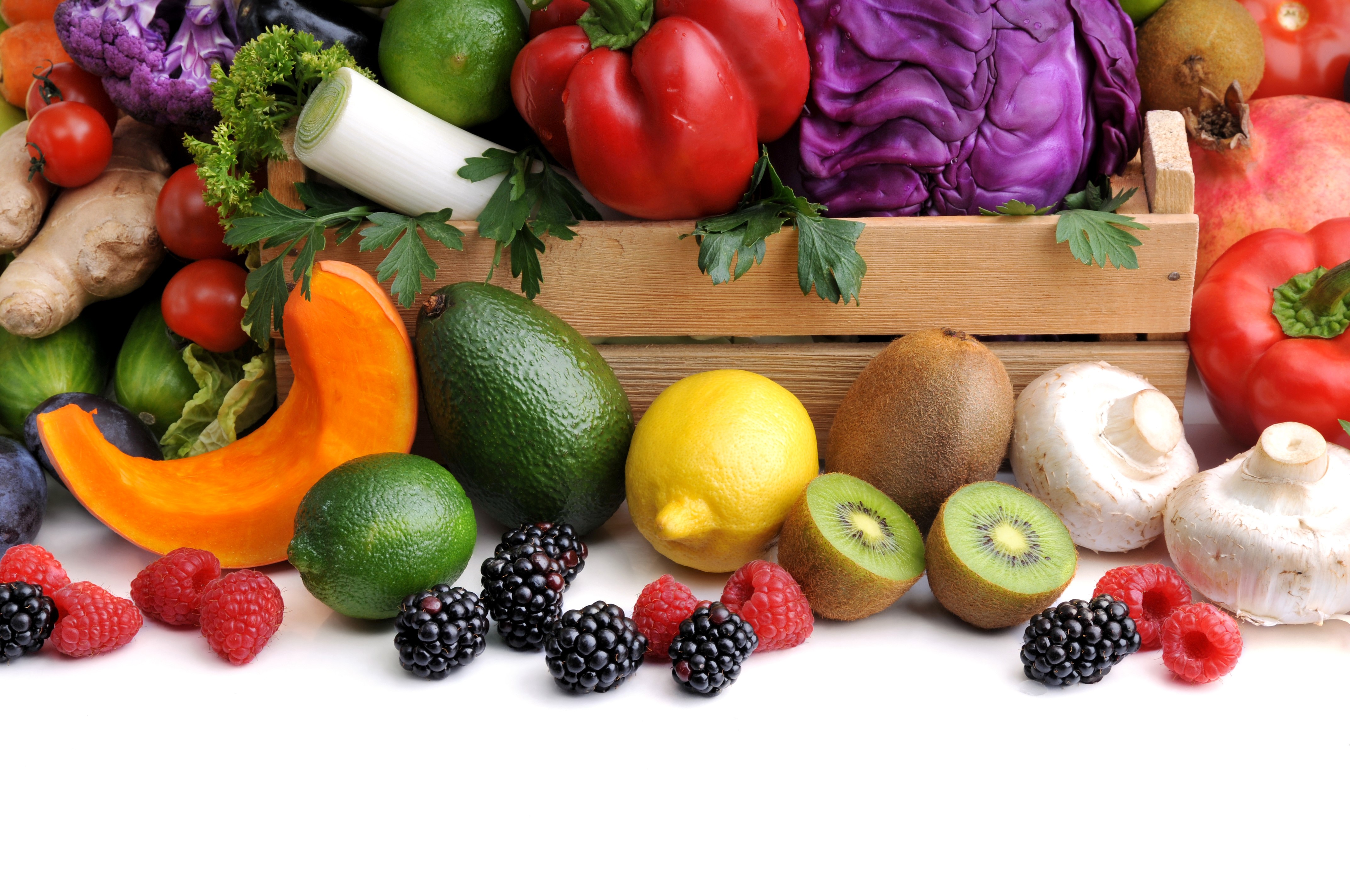 Assortment of fresh fruits and vegetables in a wooden crate HD Wallpaper