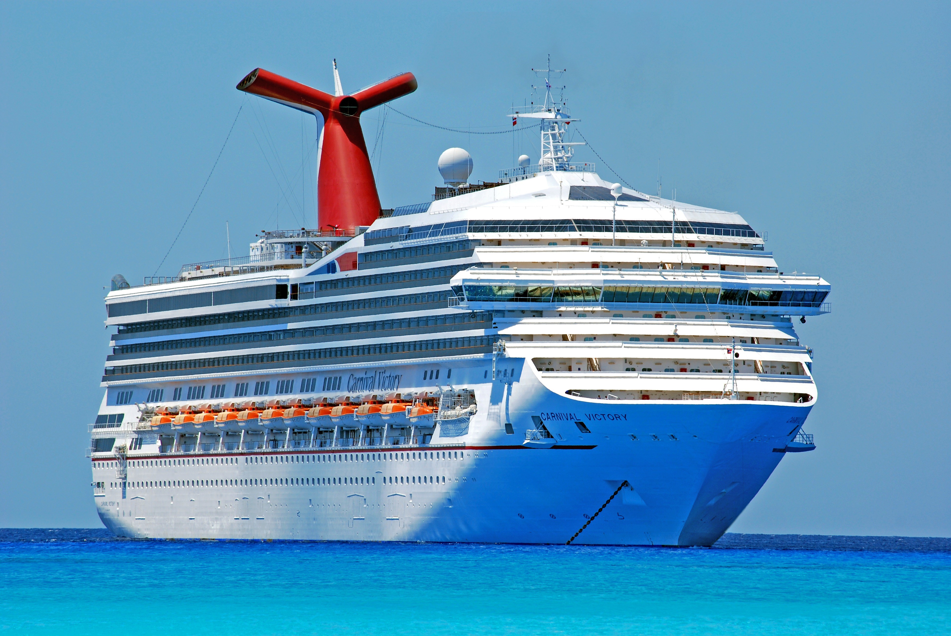 Carnival Victory cruise liner on blue water HD Wallpaper