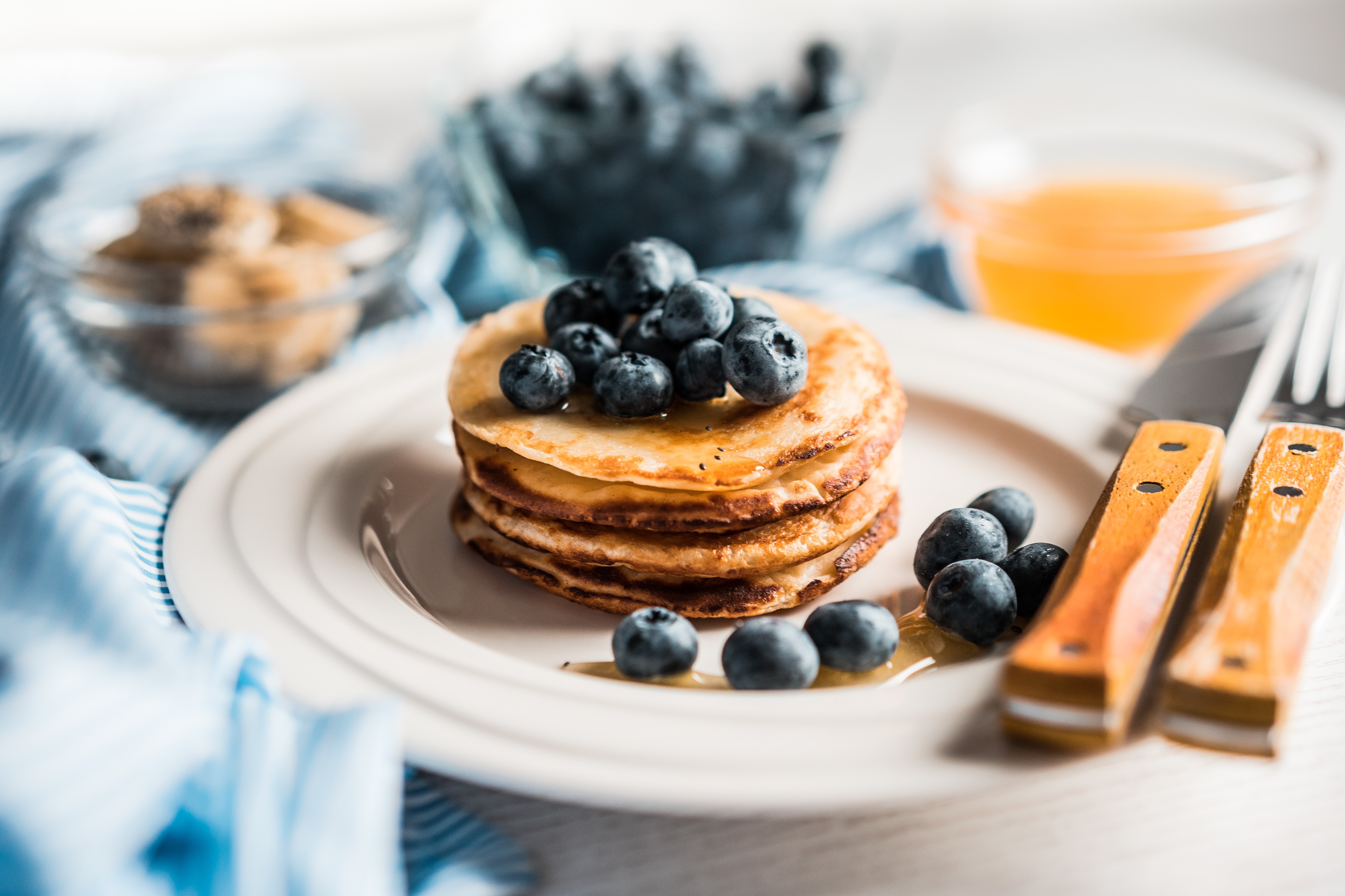 Pancakes with blueberries and honey on a plate HD Wallpaper