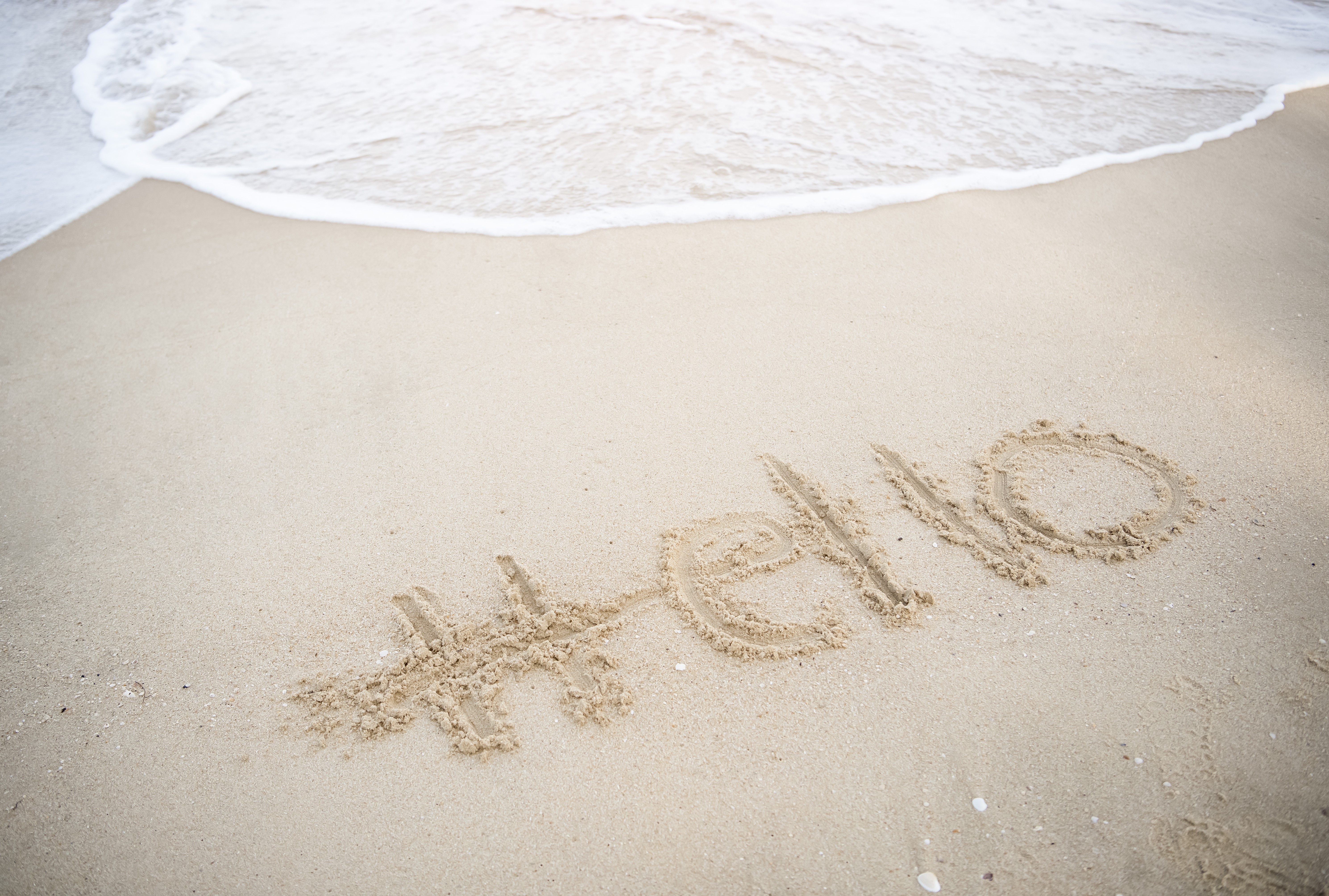 #Hello written in the sand on a beach HD Wallpaper