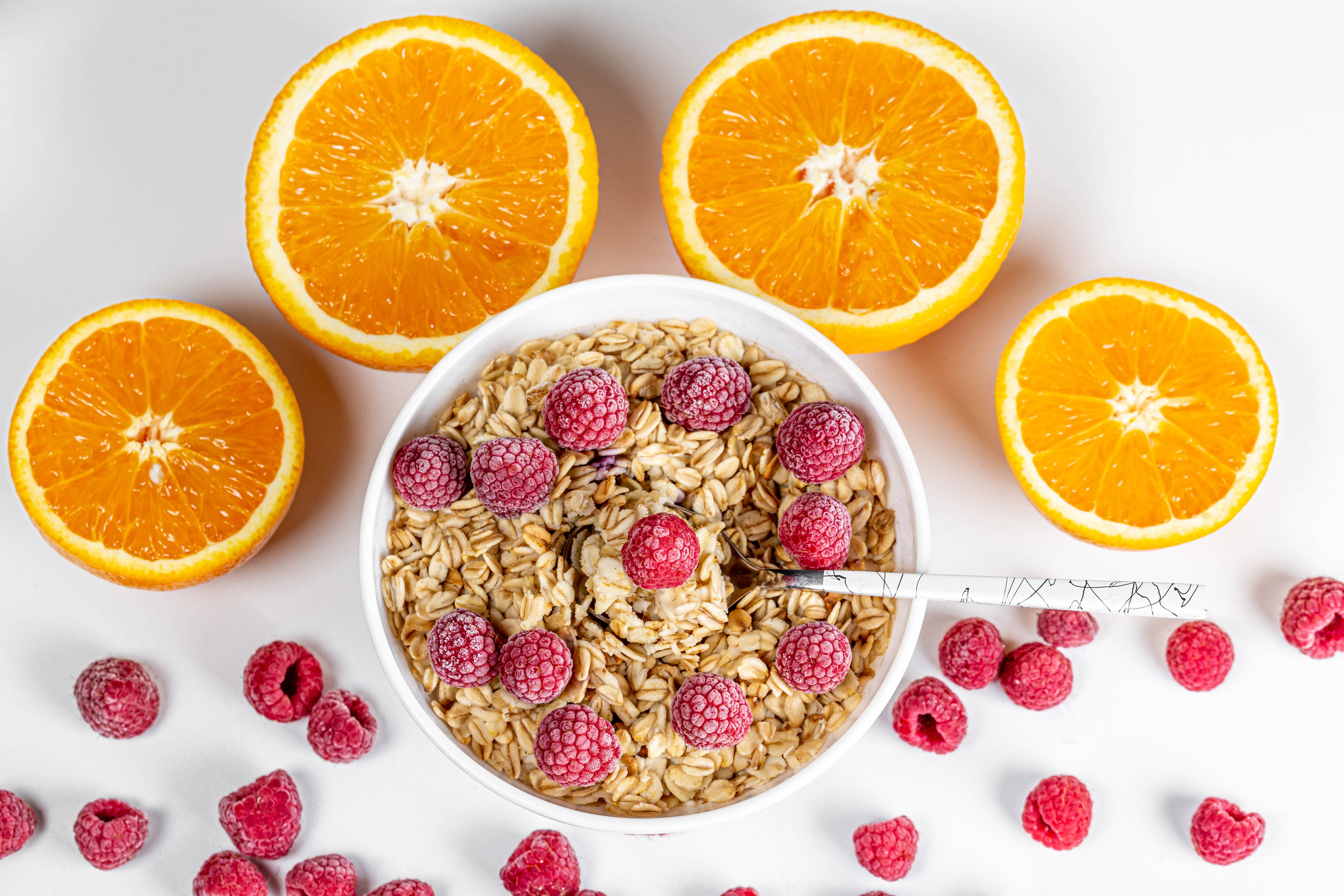 Muesli with raspberries and oranges HD Wallpaper