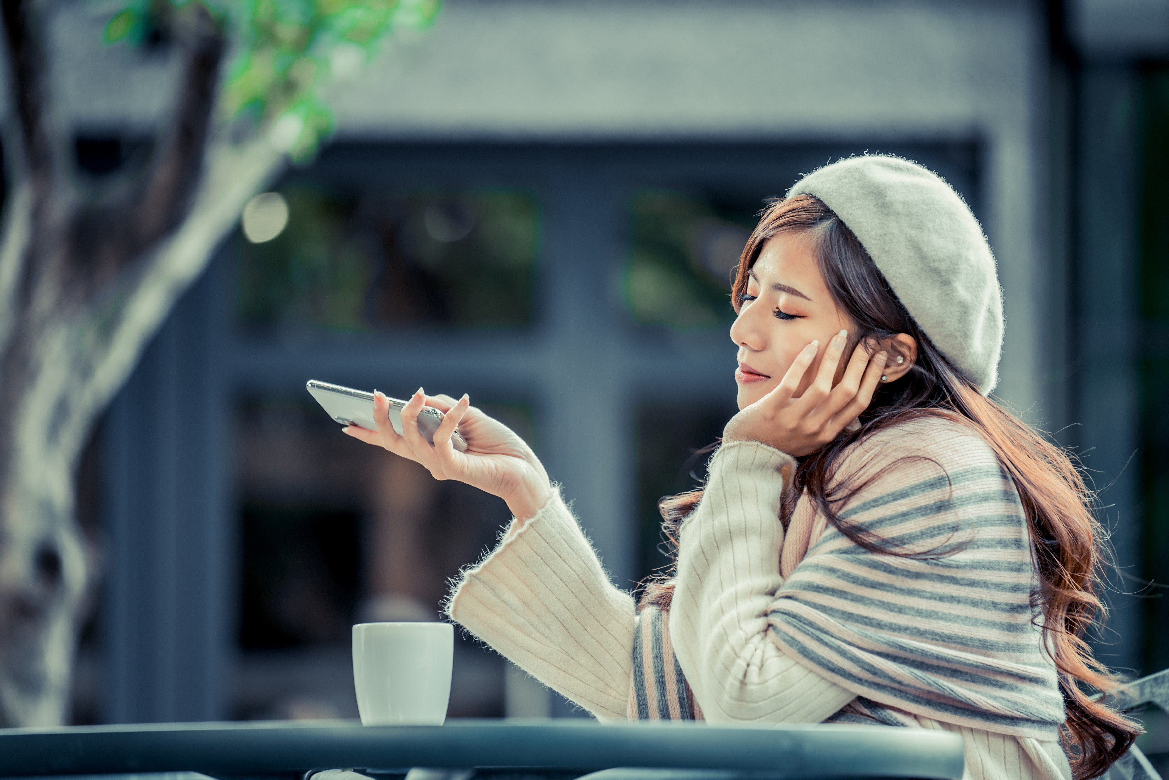 Asian woman in beret with smartphone and coffee HD Wallpaper