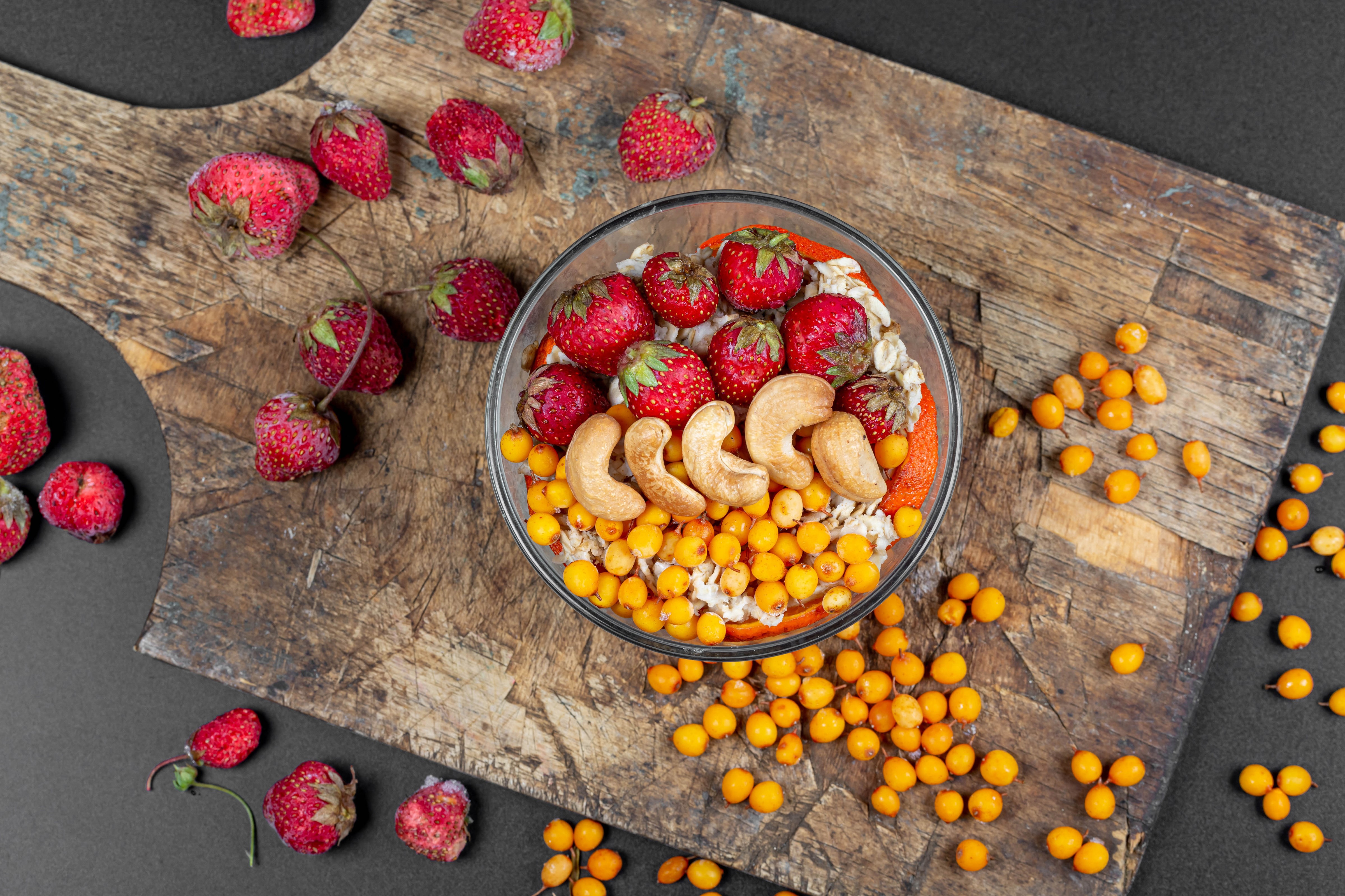 Muesli with strawberries, cashews, and sea buckthorn HD Wallpaper