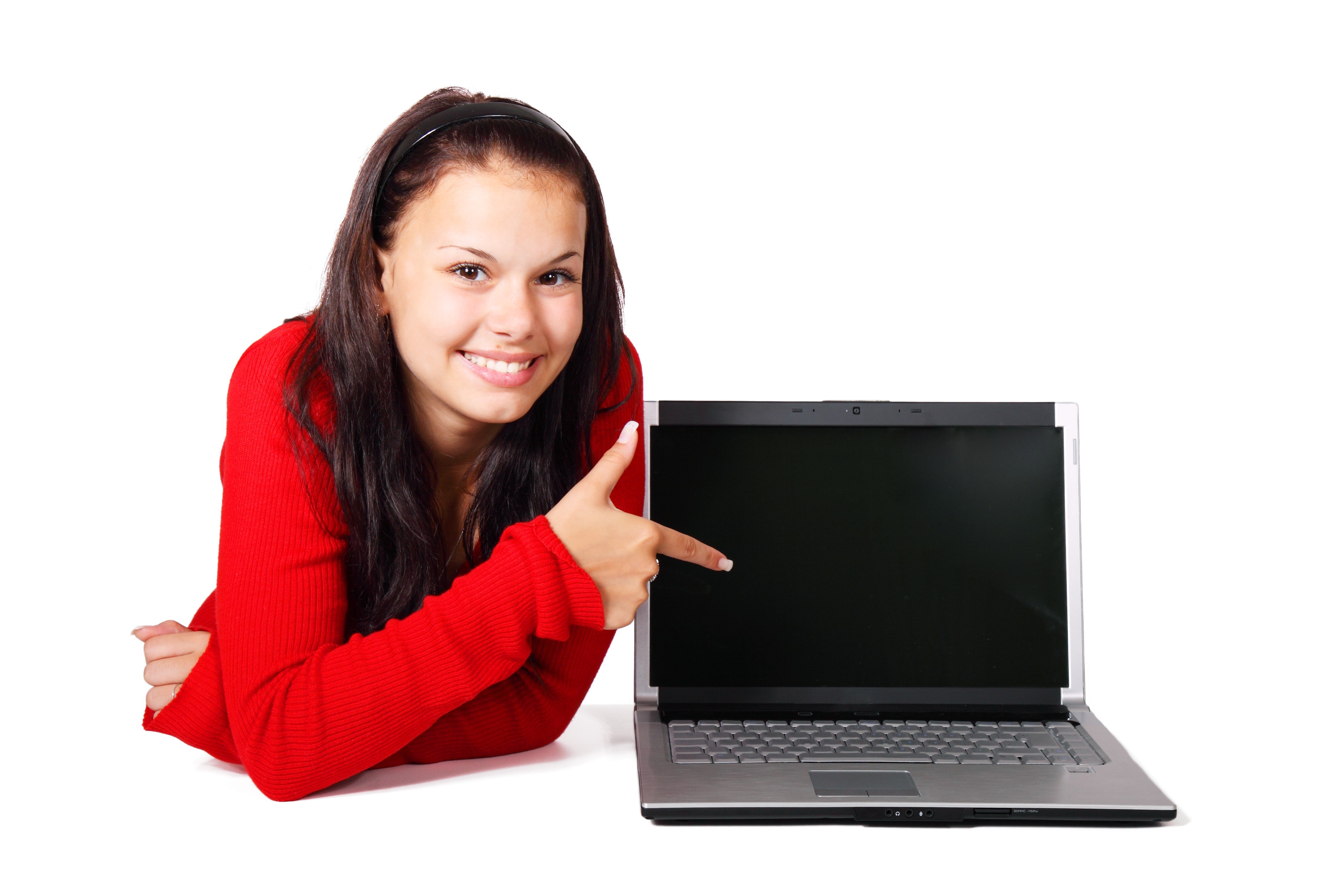 Young woman pointing at a laptop on white background HD Wallpaper