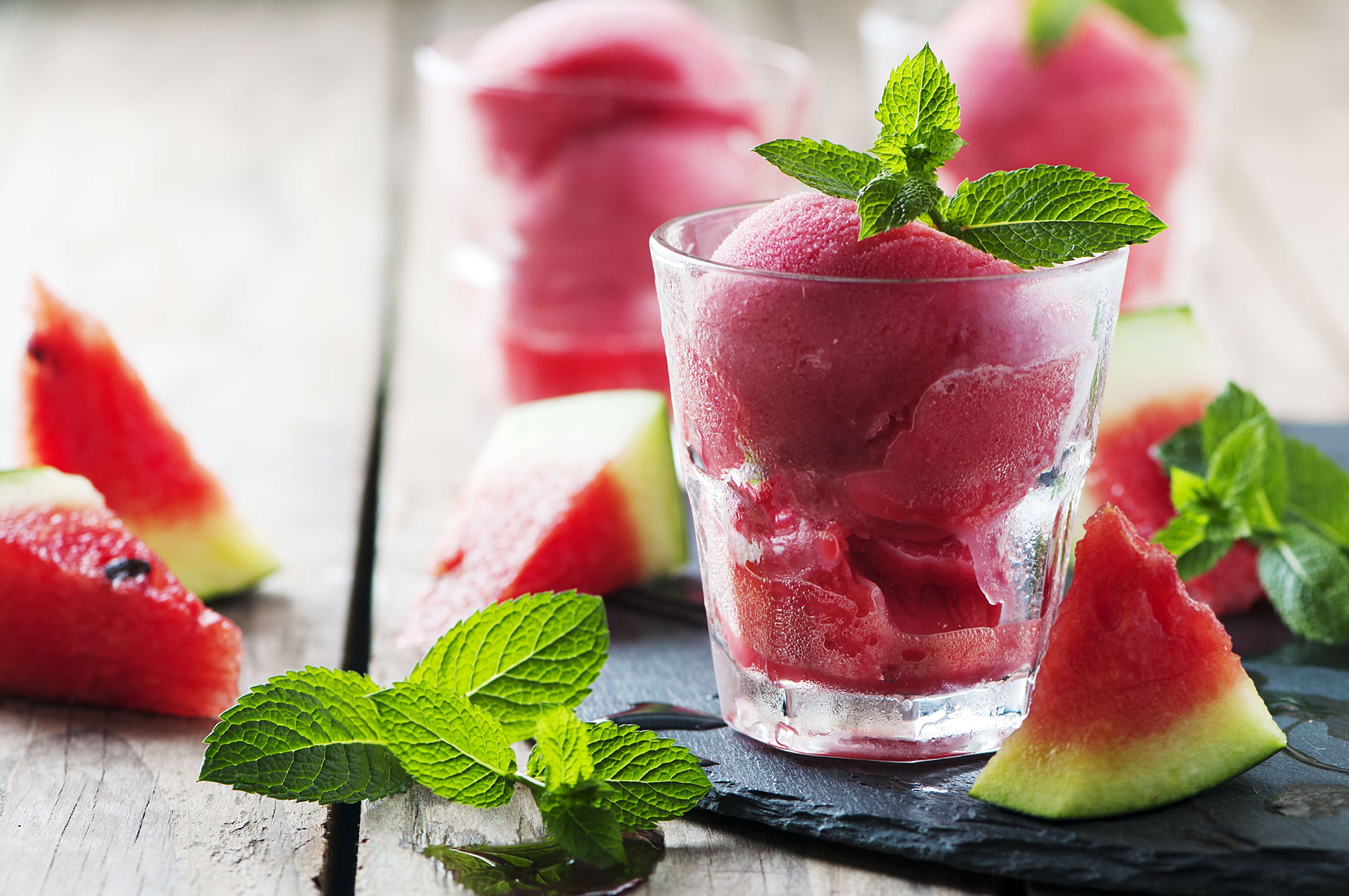 Watermelon sorbet in a glass with mint and watermelon pieces HD Wallpaper