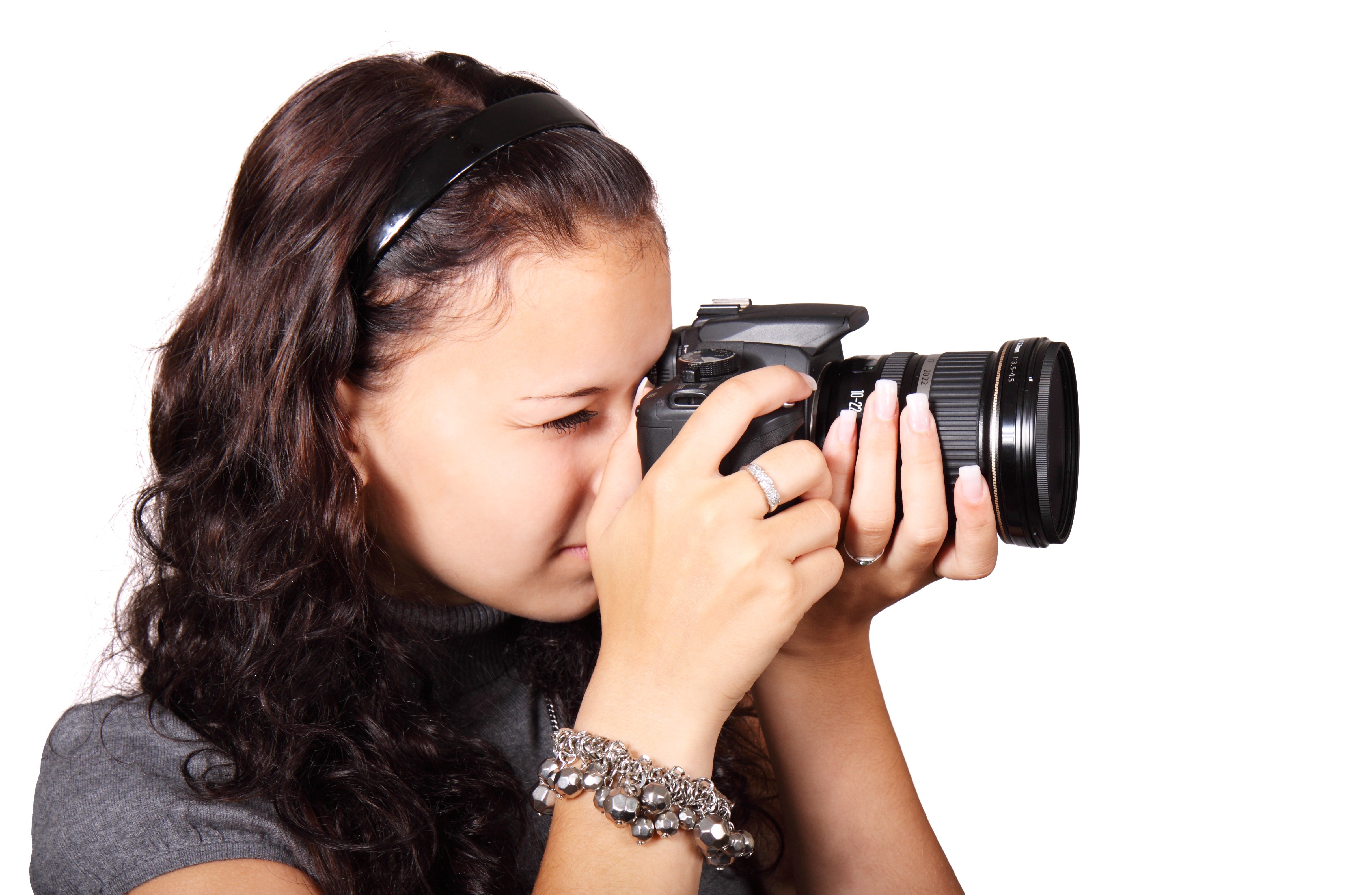 Woman with Brown Hair Holding a Camera HD Wallpaper