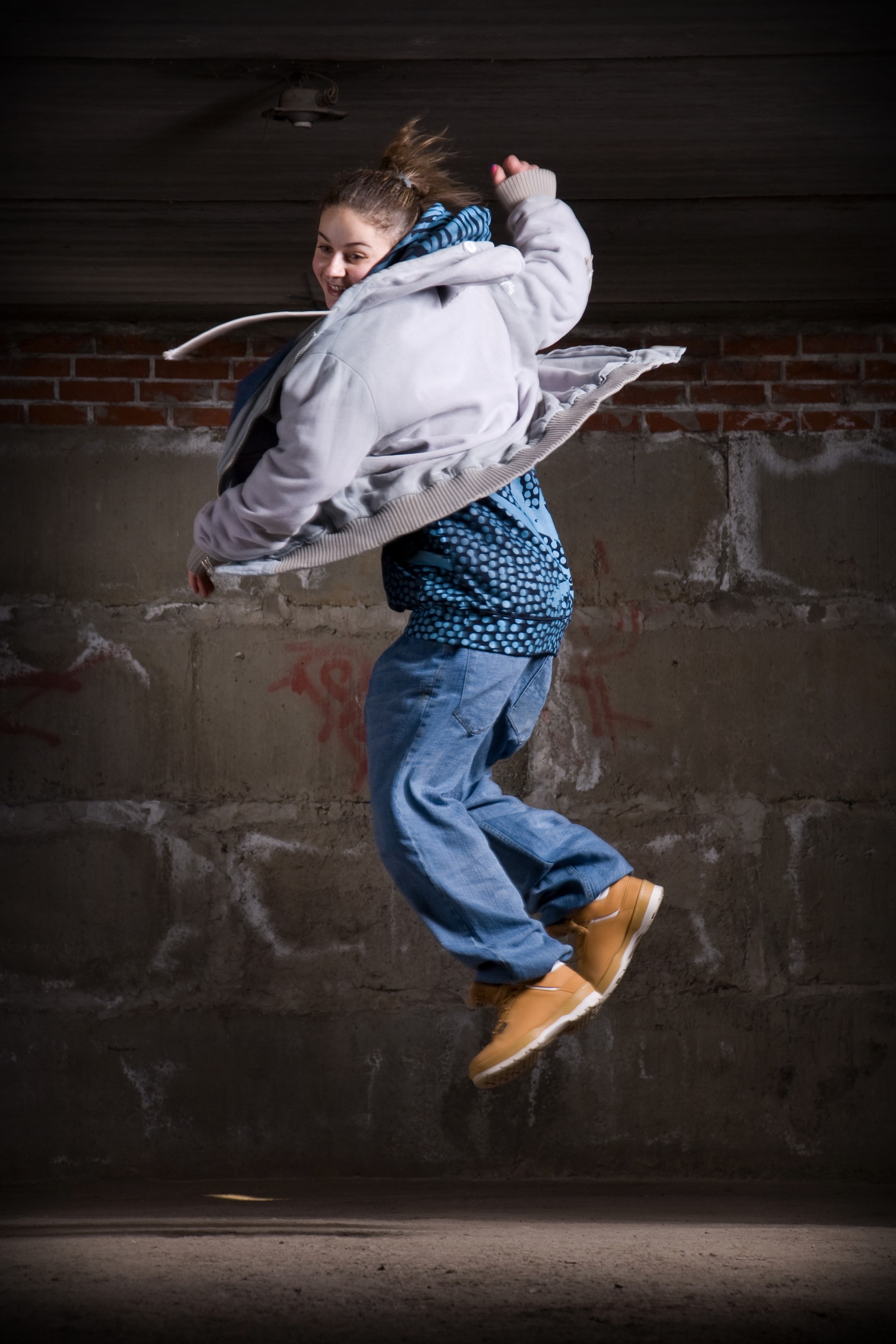 Girl in jacket and jeans jumping HD Phone Wallpaper
