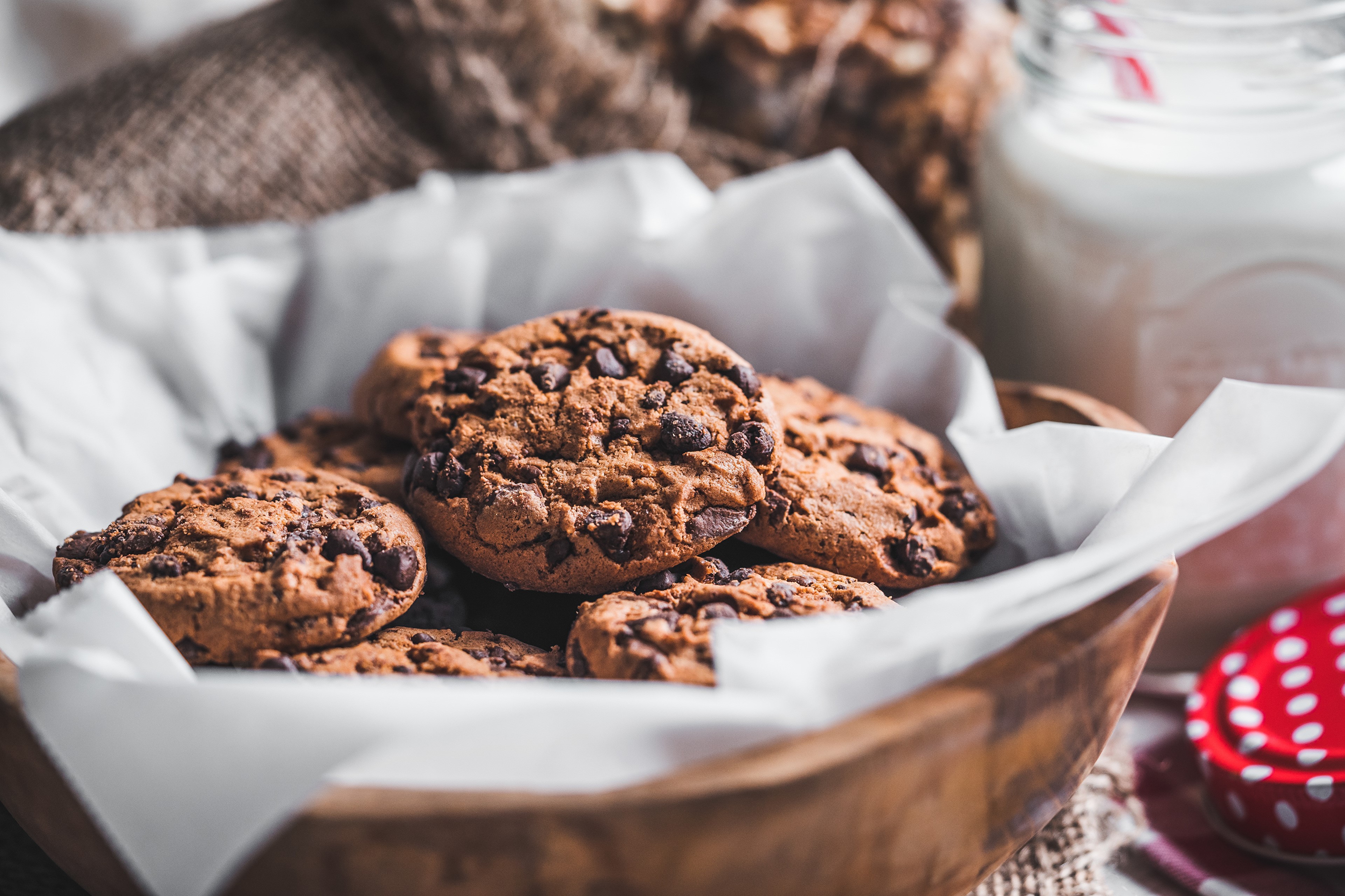 Chocolate chip cookies in a bowl with milk HD Wallpaper
