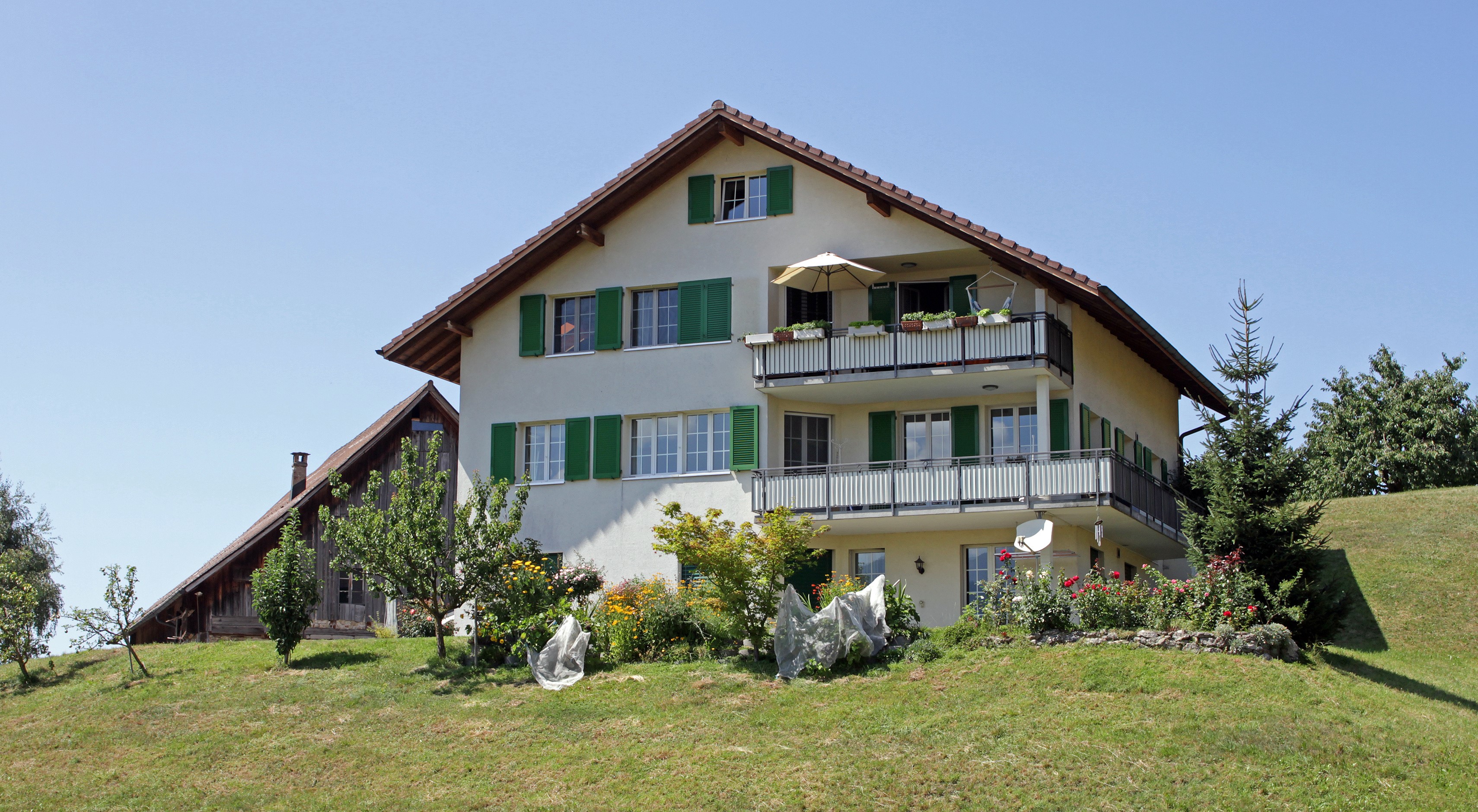 Swiss houses with green shutters and balconies HD Wallpaper