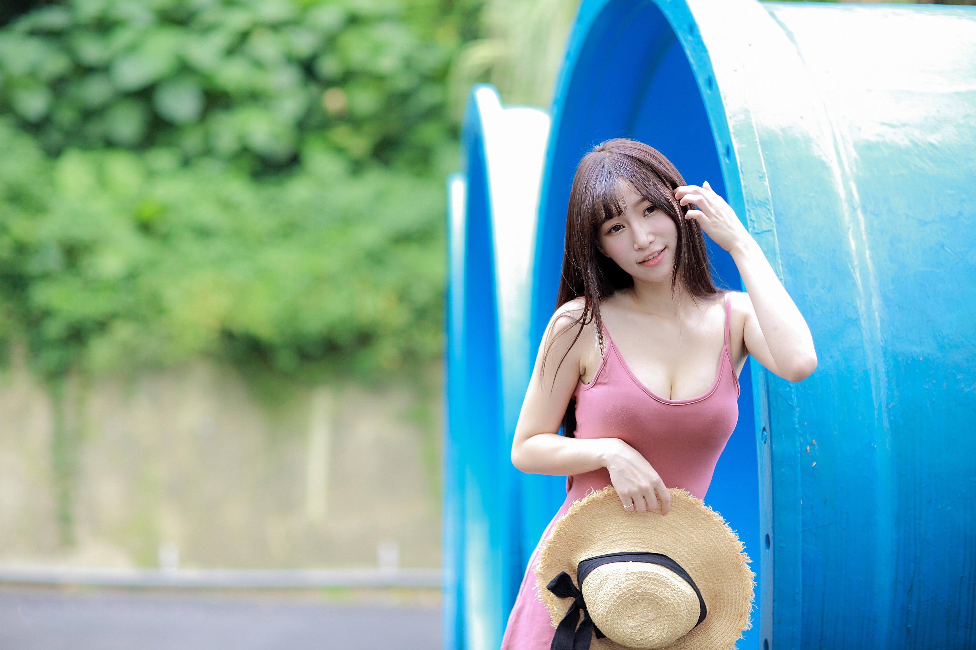 Asian woman in pink dress holding a hat HD Wallpaper